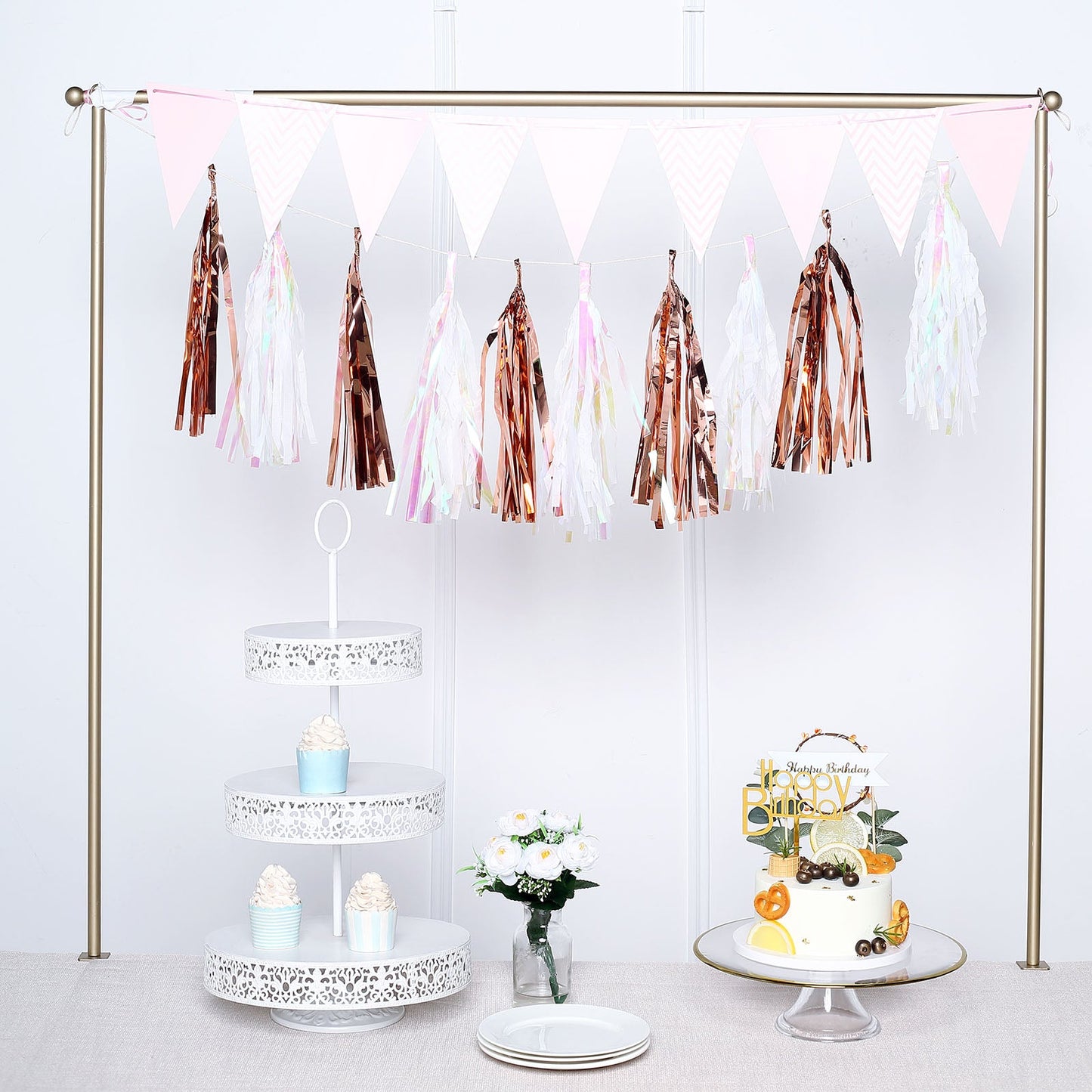 Rose gold hanging foil tassel garland backdrop for party decorations.