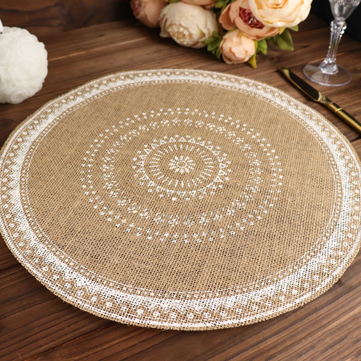 Natural jute and white braided placemat on a wooden table.