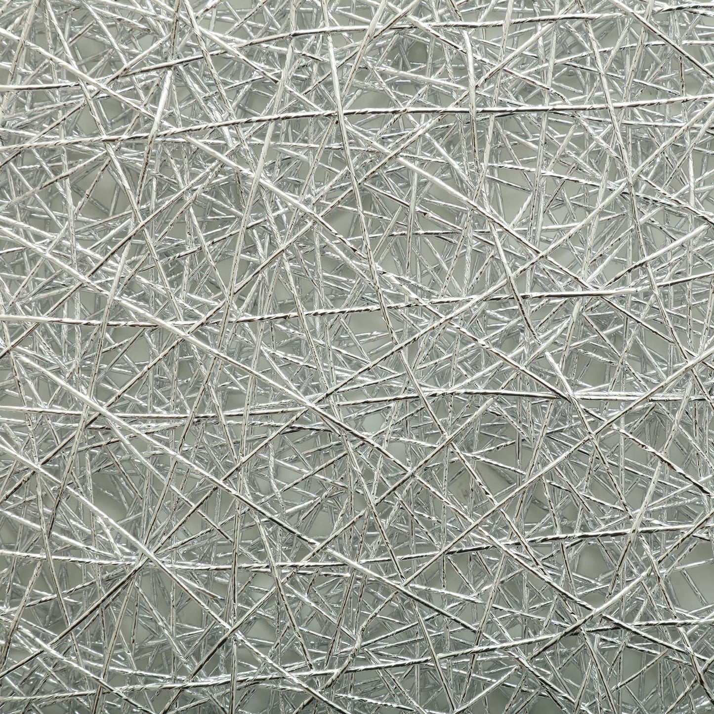 Silver metallic woven disposable placemats for round tables.