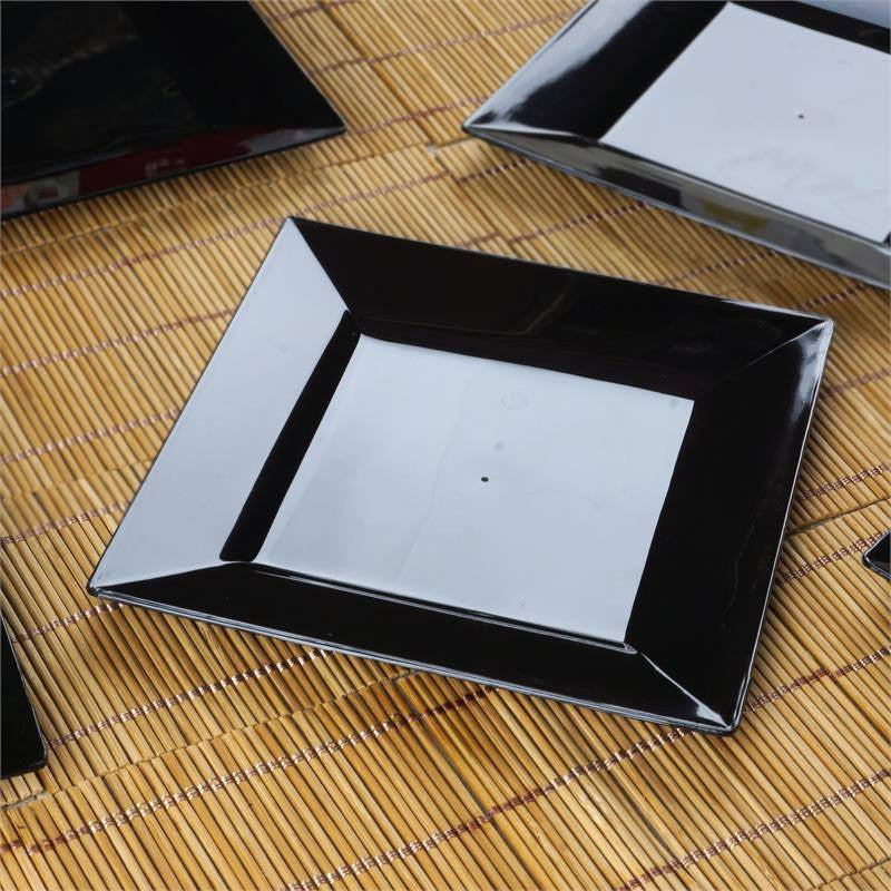 Black glossy square disposable plates for salads and desserts.