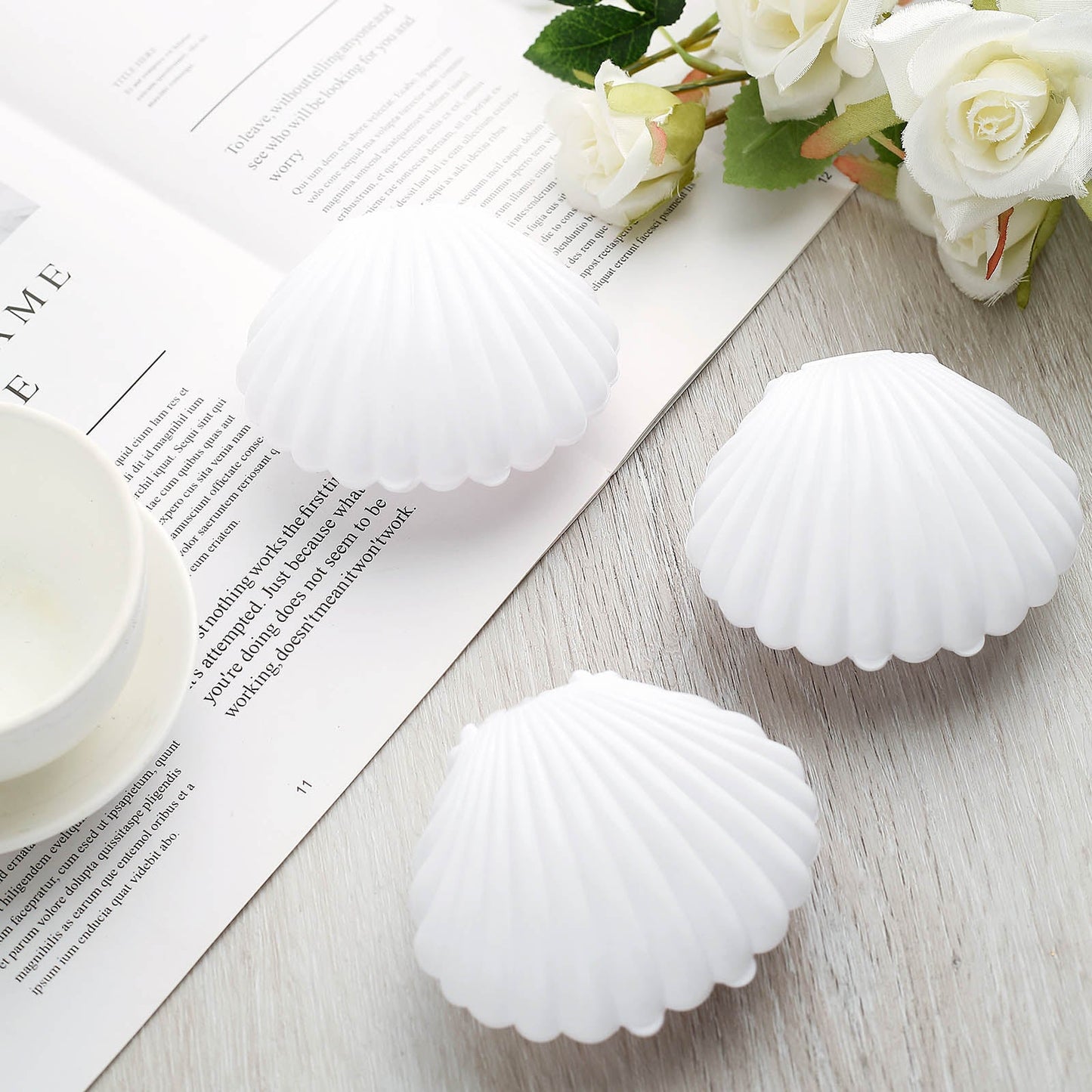 White seashell gift boxes for beach weddings and baby showers.