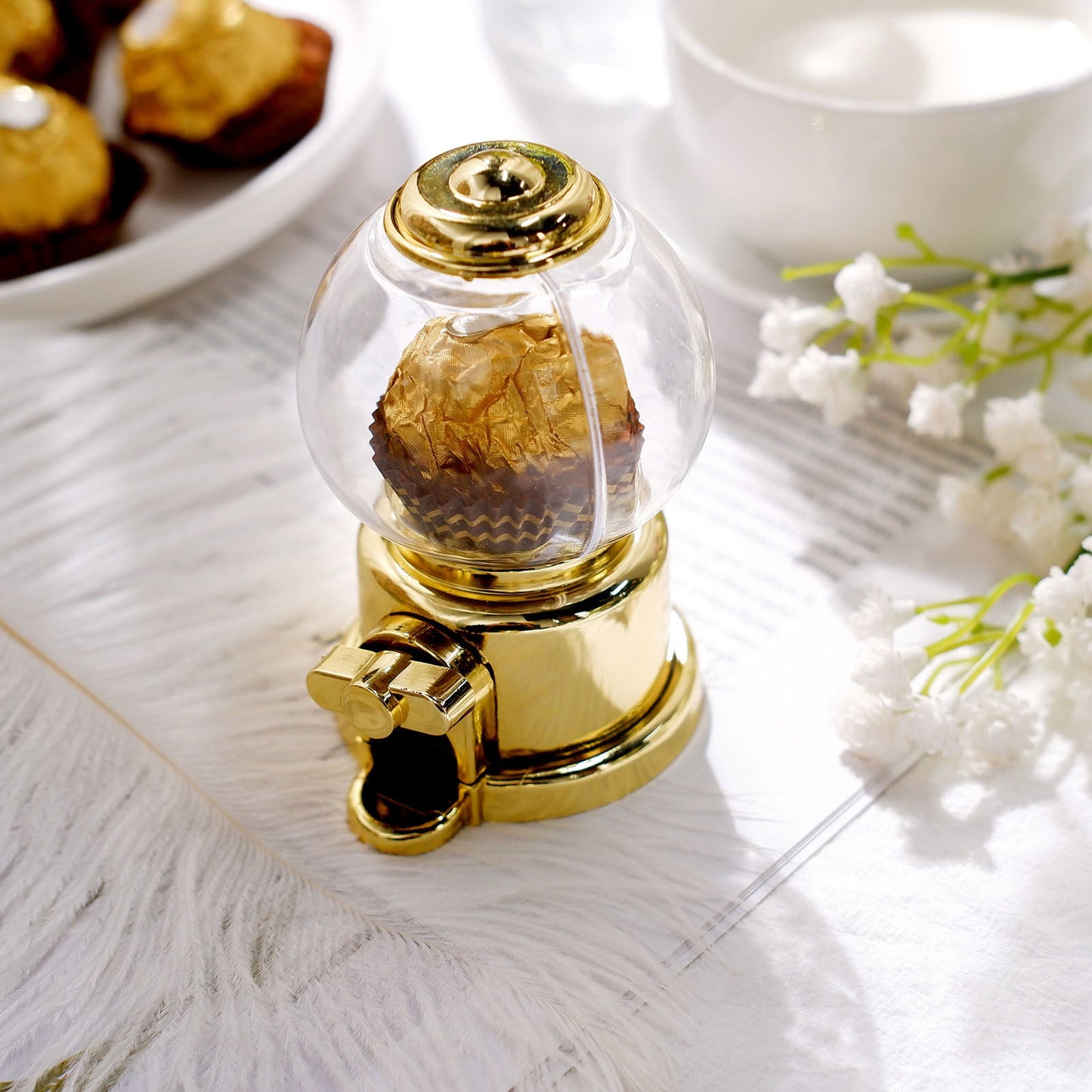 Gold mini gumball machine with candy treat container for party favors.
