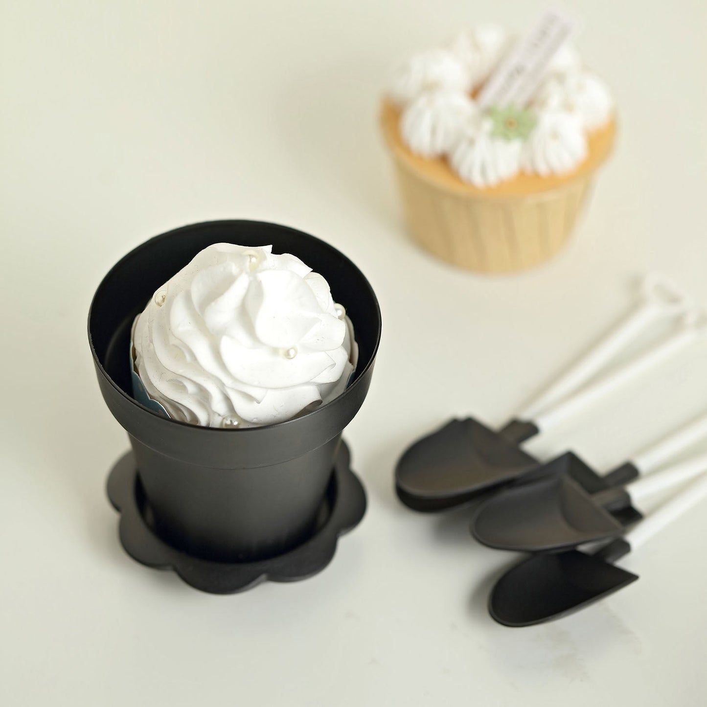 Black small favor jar with whipped cream and accessories.