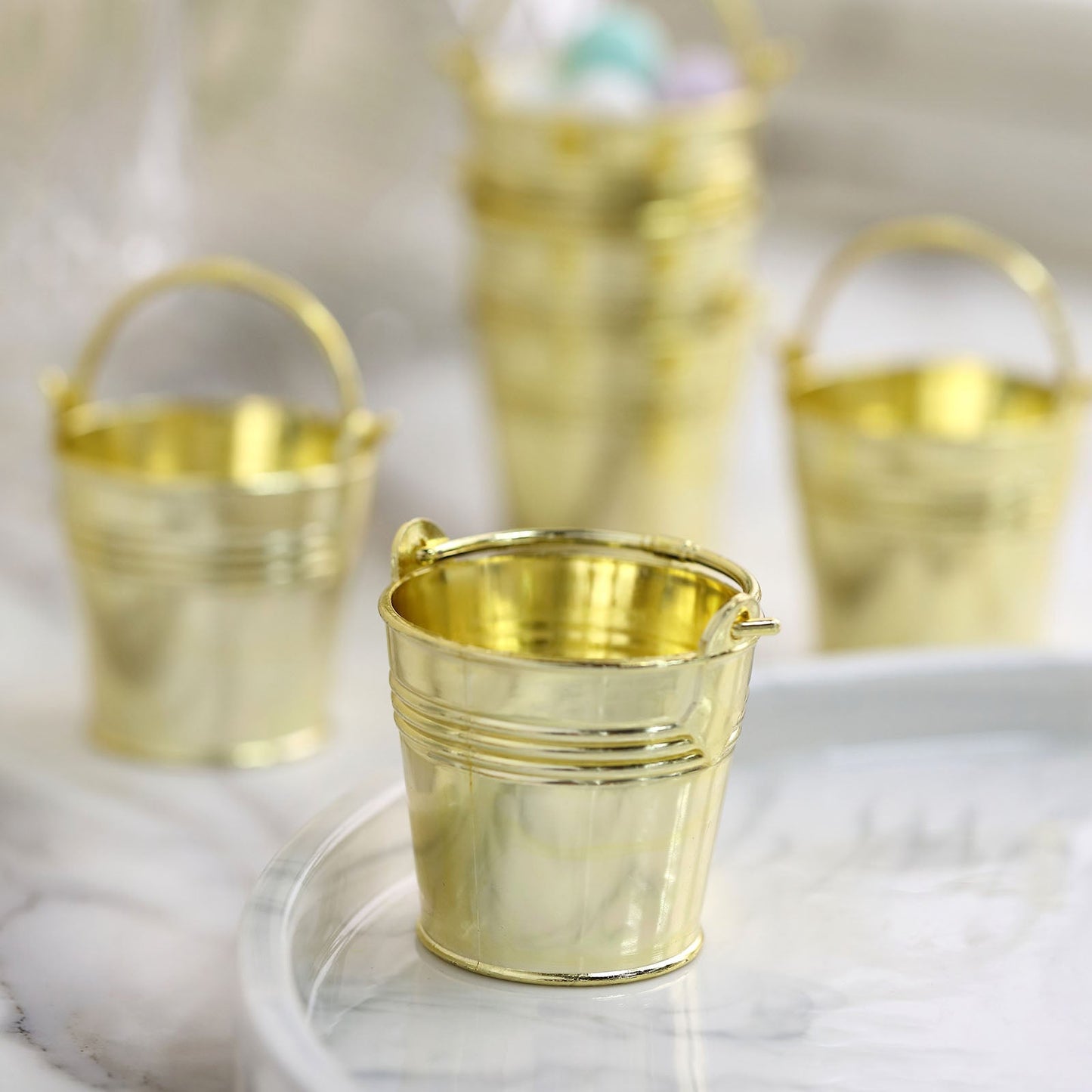 Gold mini pail buckets for party favors and candy gifts.