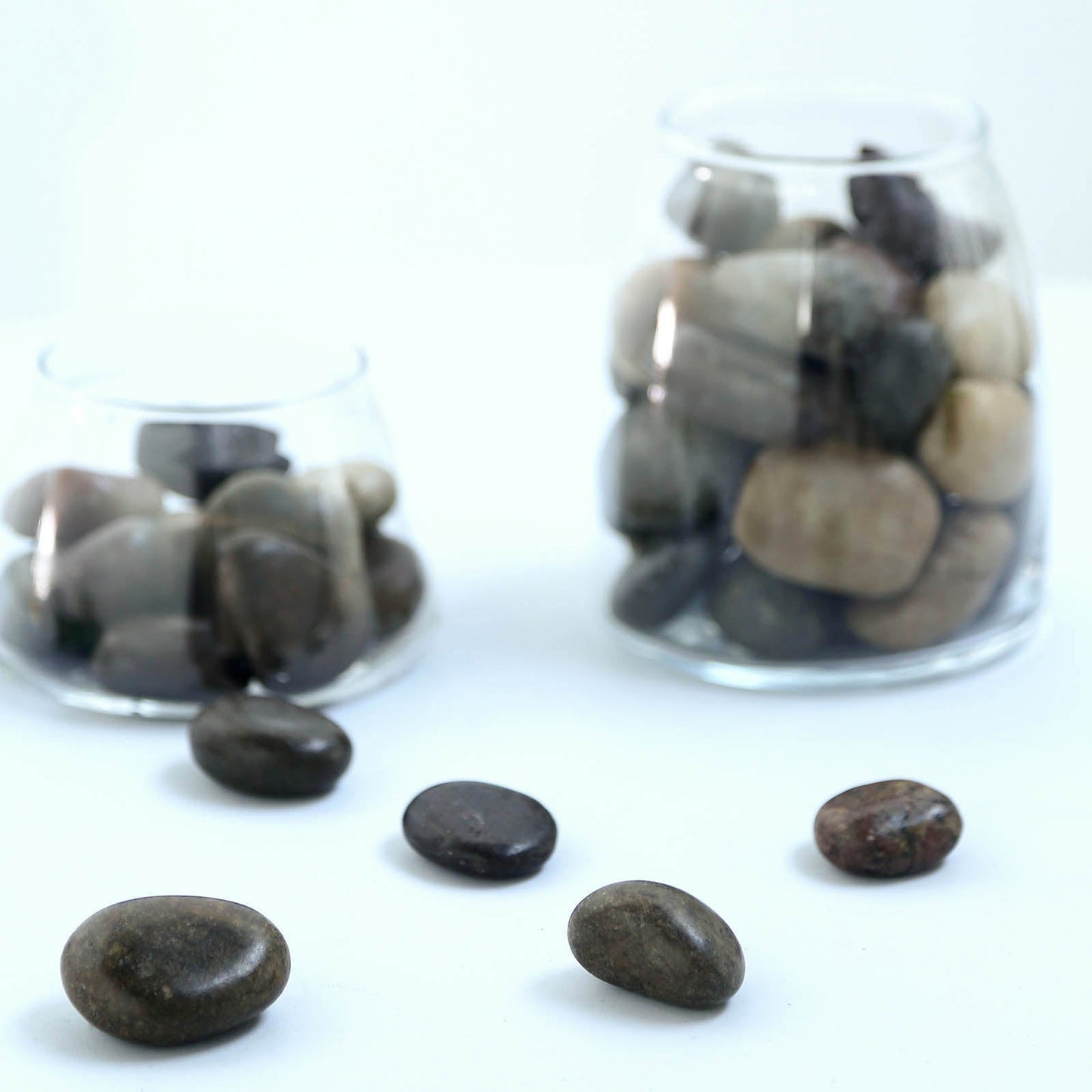 Assorted natural polished decorative stones for vases and landscaping.