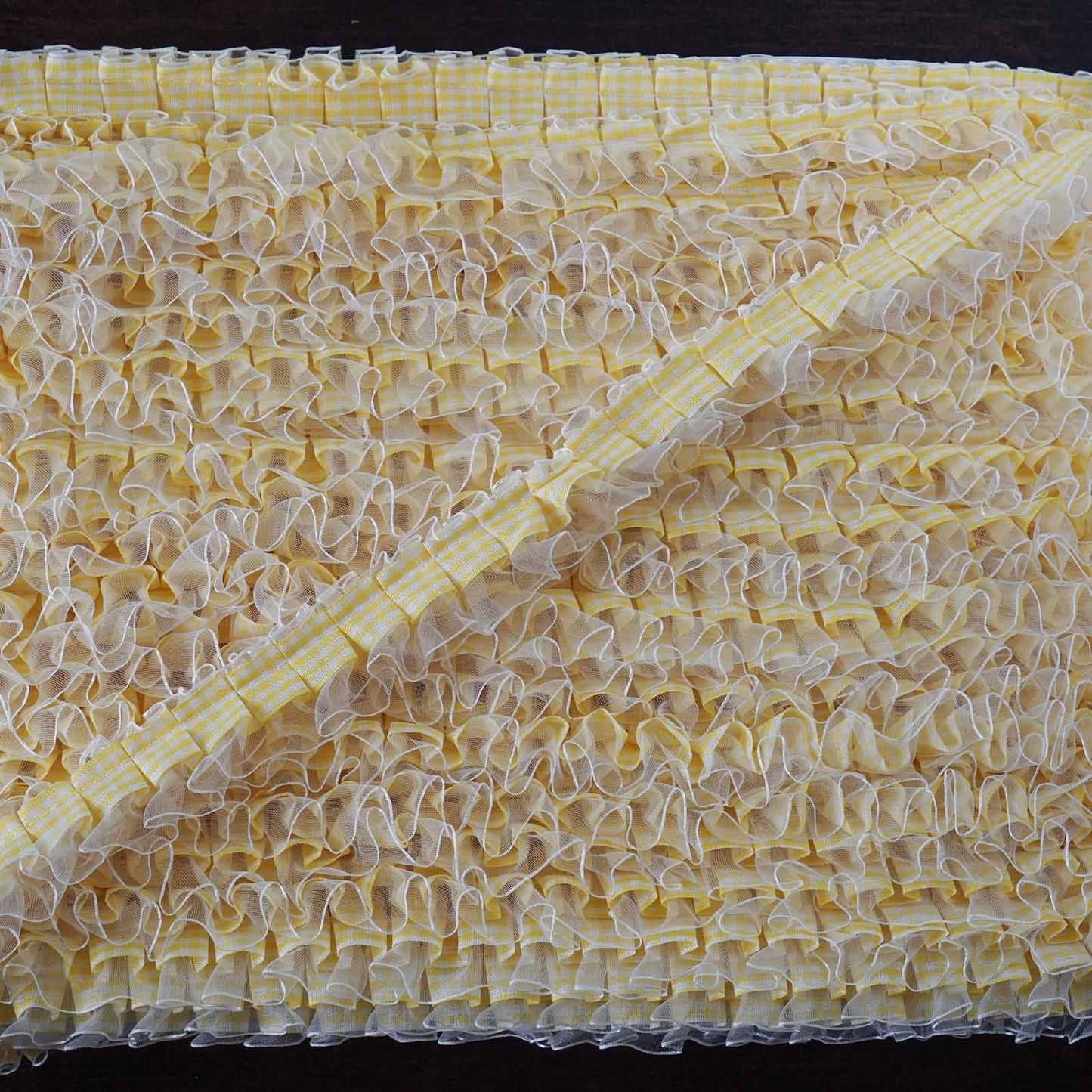 Yellow double layered ruffled lace trim with satin edging and gingham pattern.
