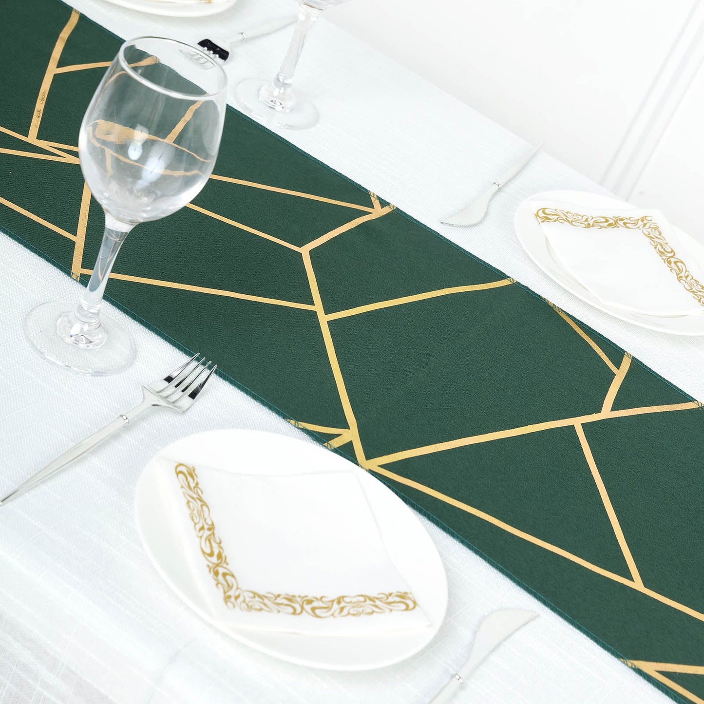 Emerald green table runner with gold foil geometric pattern.