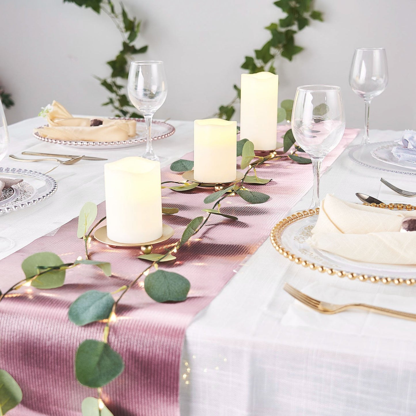 9ft rose gold disposable paper table runner on an elegantly set dining table.
