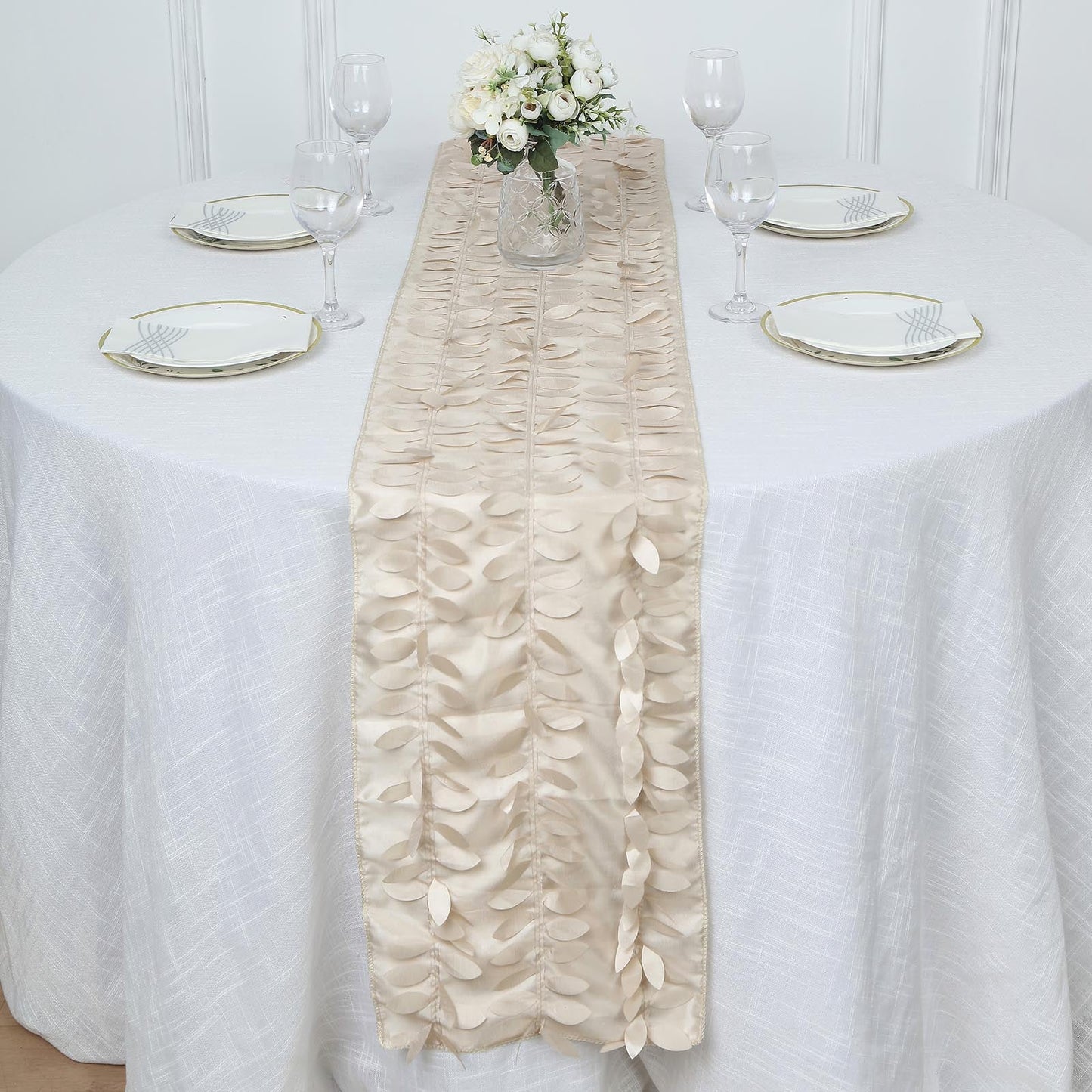 Beige 3D leaf petal taffeta fabric table runner on a white table.