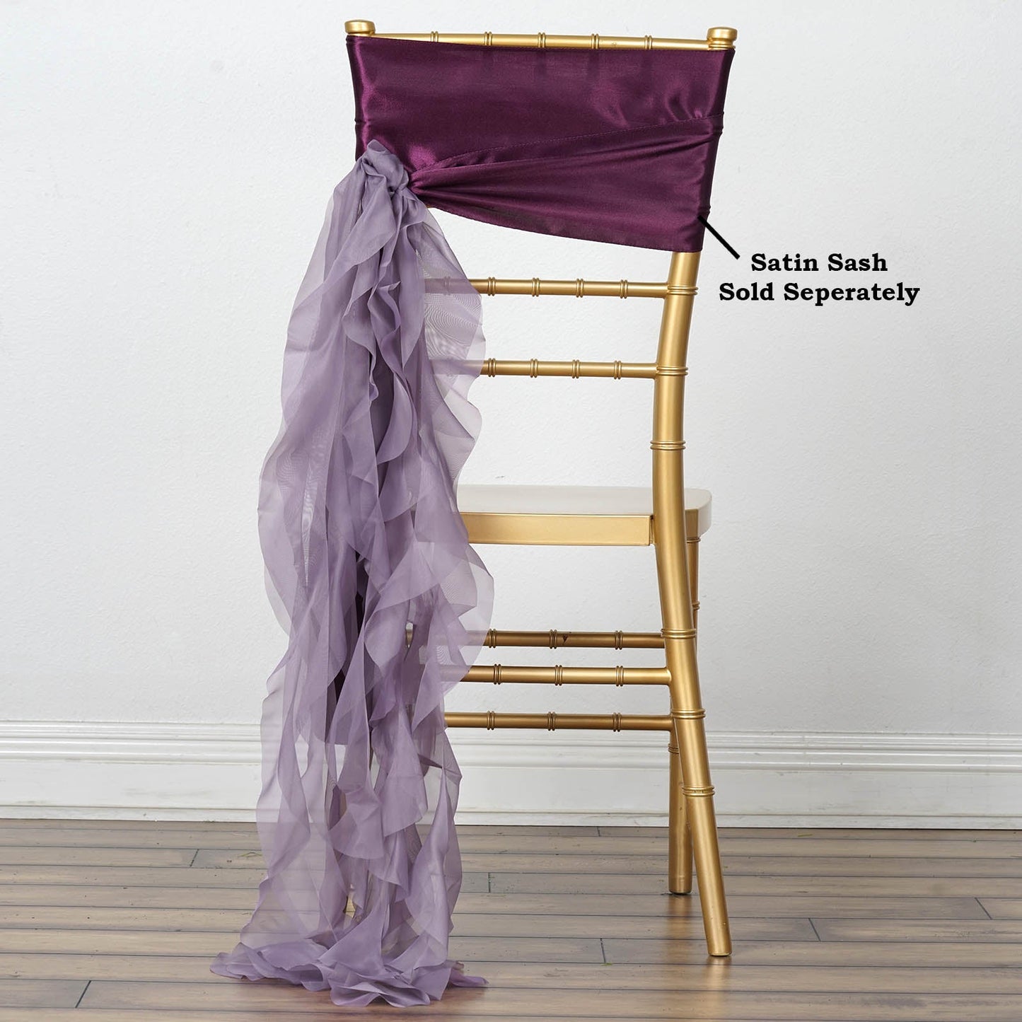 Violet amethyst chiffon chair sash tied on a gold chair.
