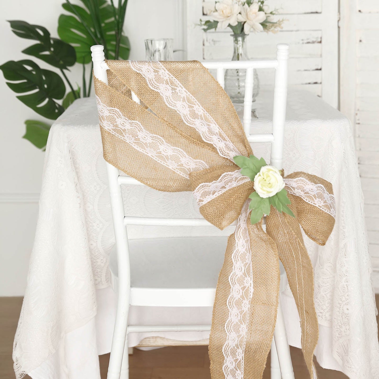 Natural burlap lace chair sash in rustic jute on a white chair.