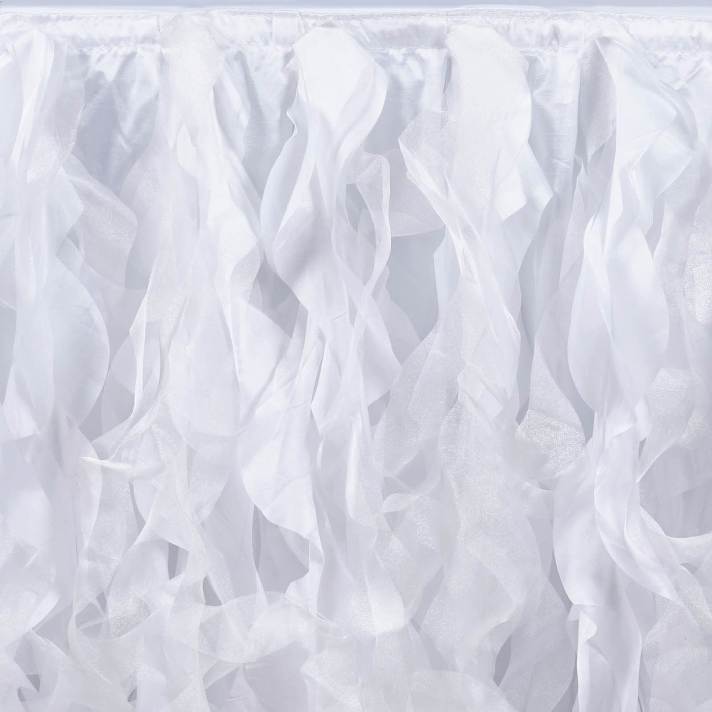 White curly willow taffeta table skirt with flowing ribbons.