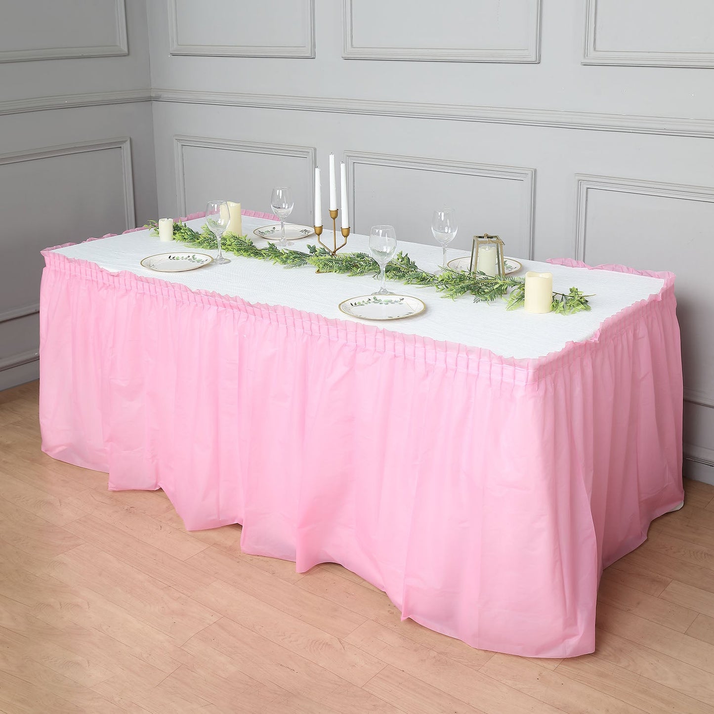 14ft Pink Ruffled Waterproof Plastic Table Skirt for indoor or outdoor use.