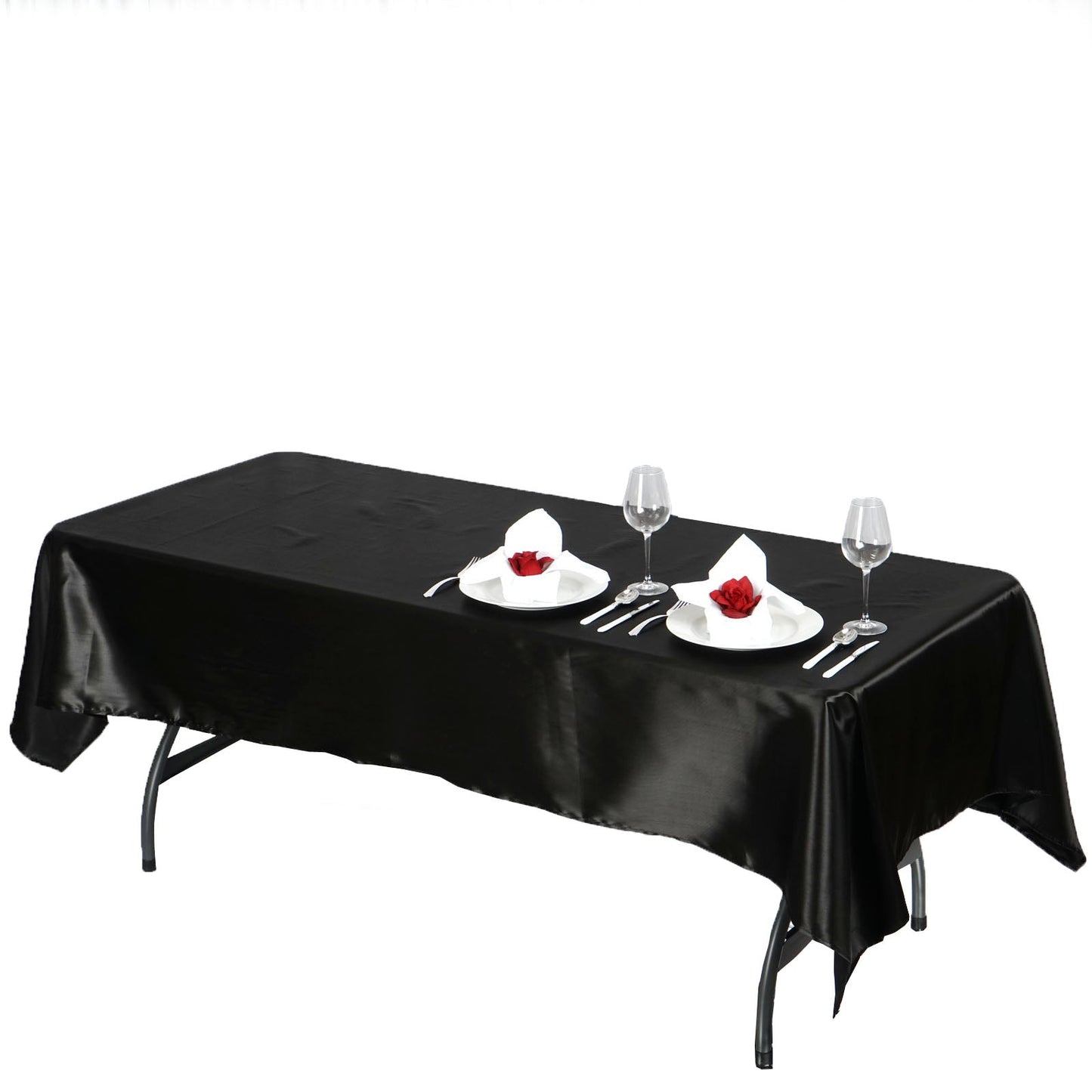 Black seamless smooth satin rectangular tablecloth on a dining table.