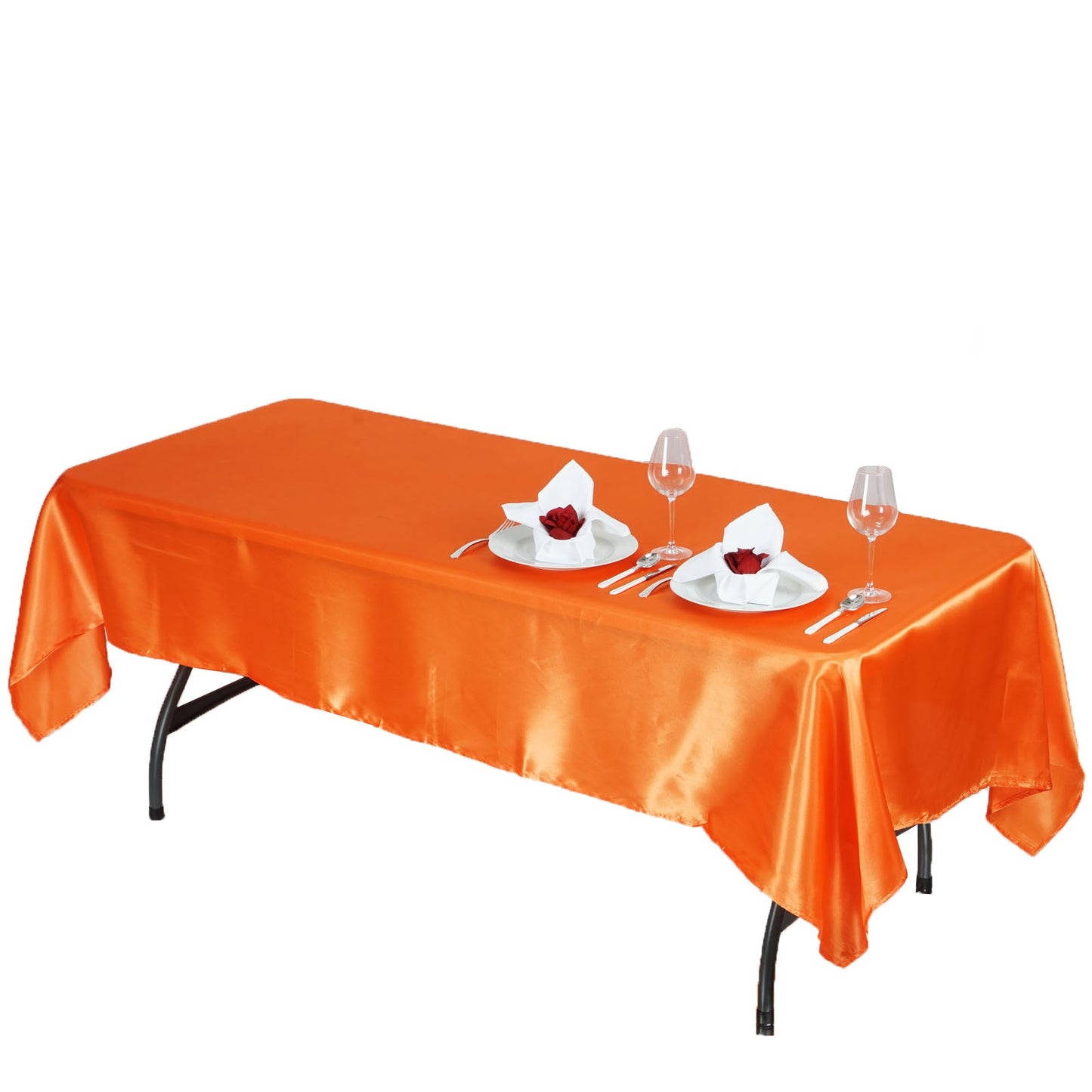Orange satin rectangular tablecloth on a dining table.