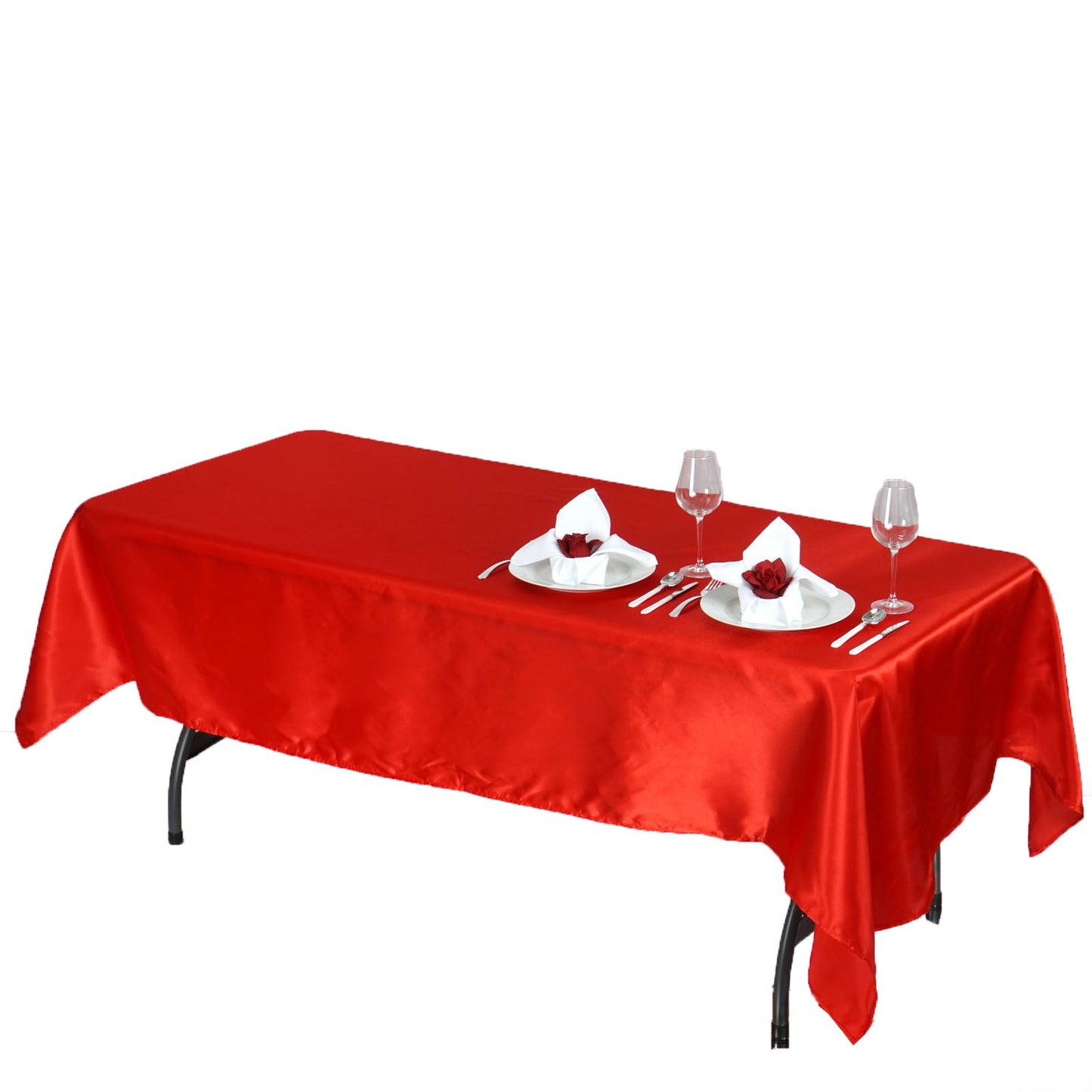 Red seamless smooth satin rectangular tablecloth on a dining table.