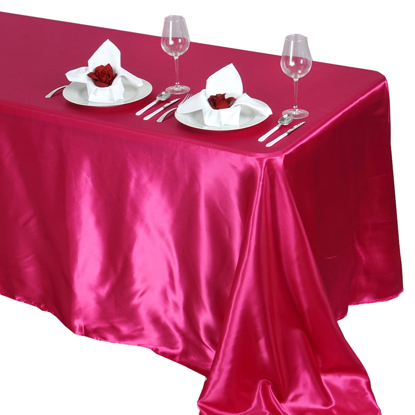 Fuchsia satin rectangular tablecloth on a dining table.