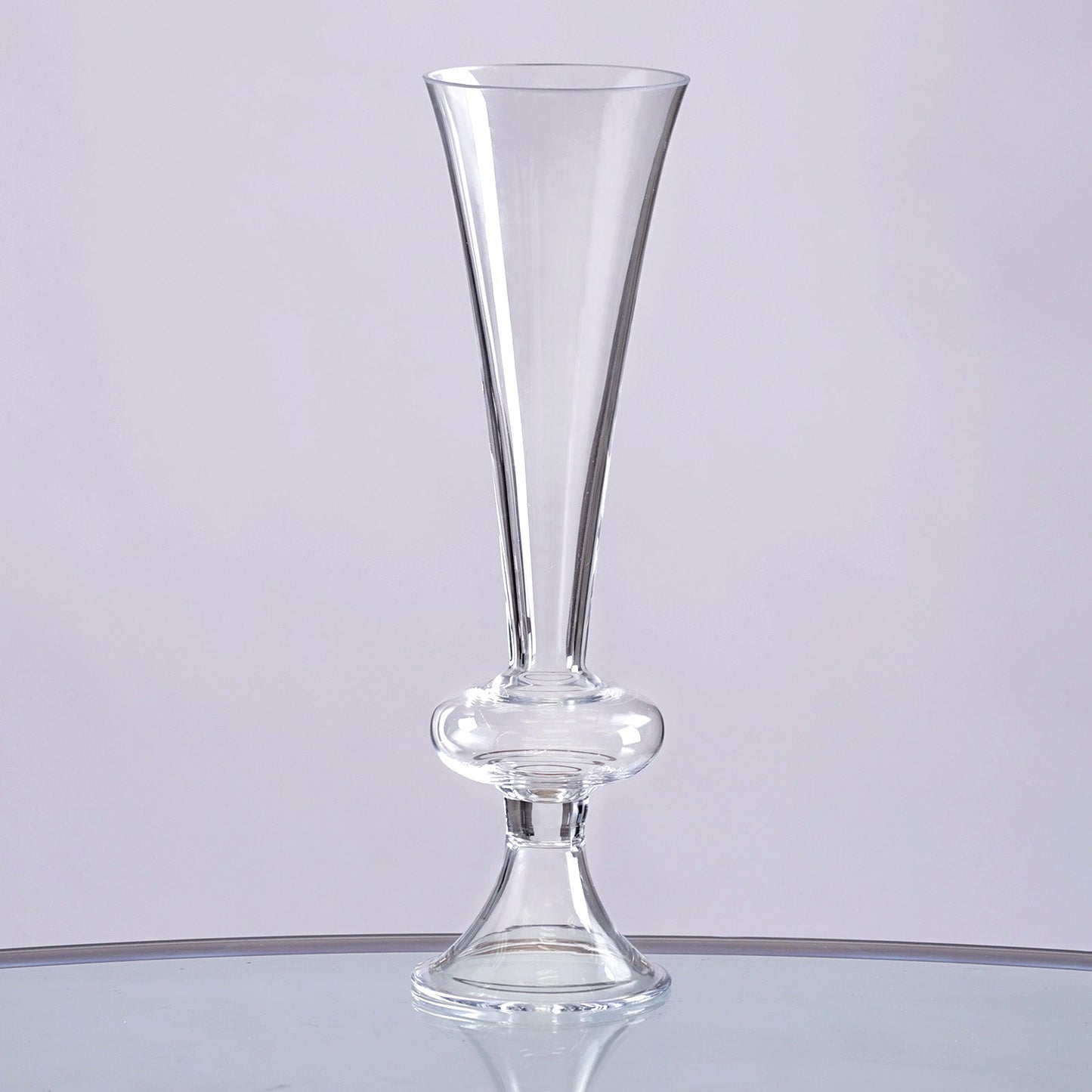 Clear glass trumpet vase, 11 inches tall, ideal for floral arrangements.