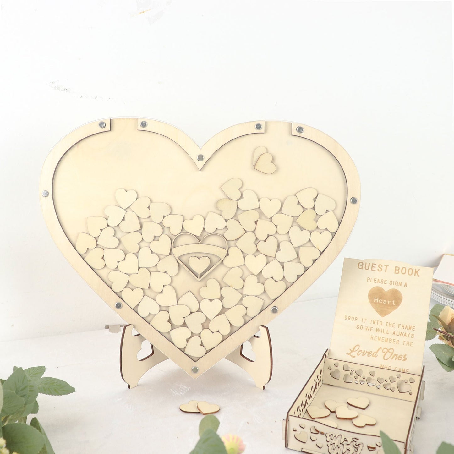 Rustic wooden heart wedding guest book sign with drop top frame.