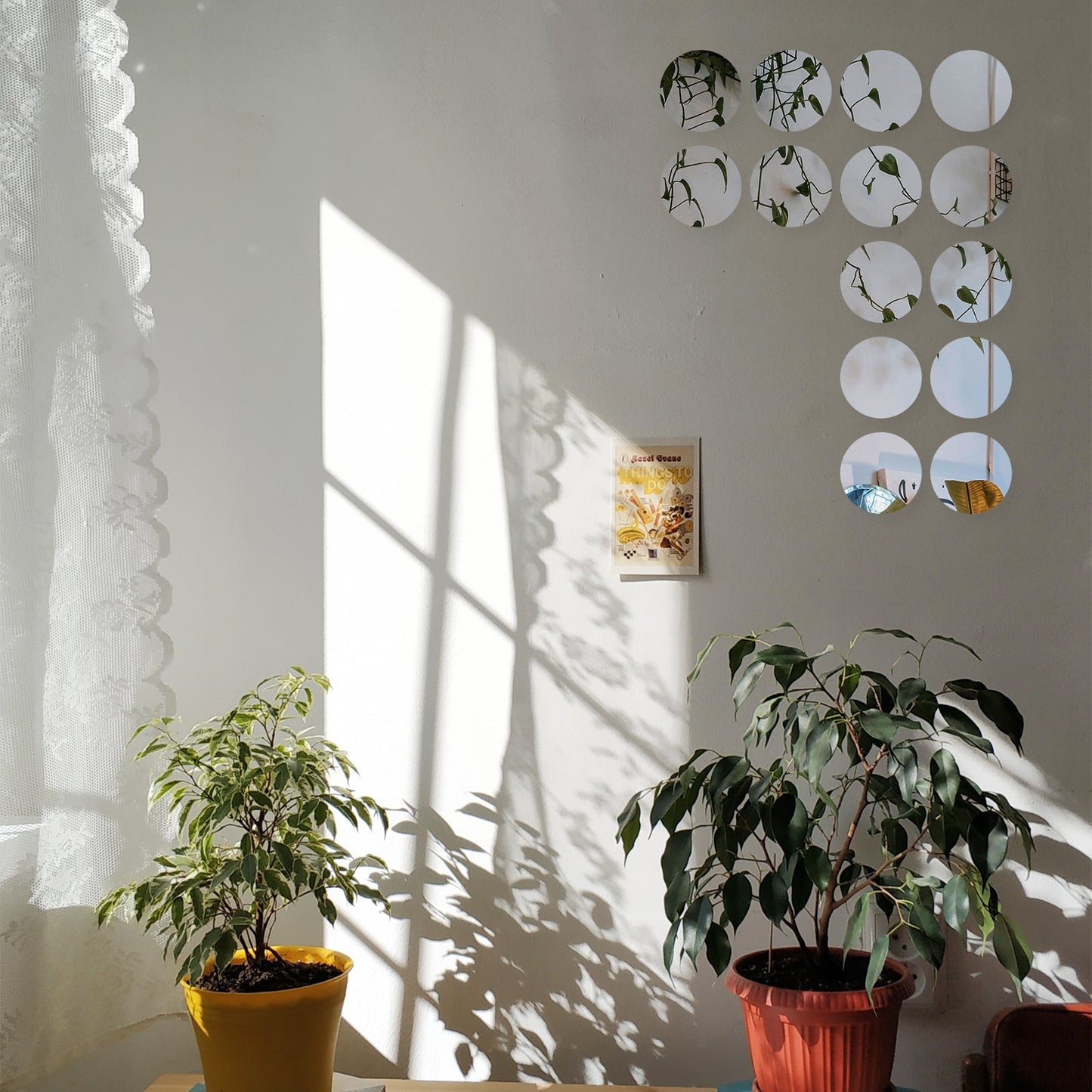 12 pack of round acrylic mirror wall stickers in a bright, reflective finish.