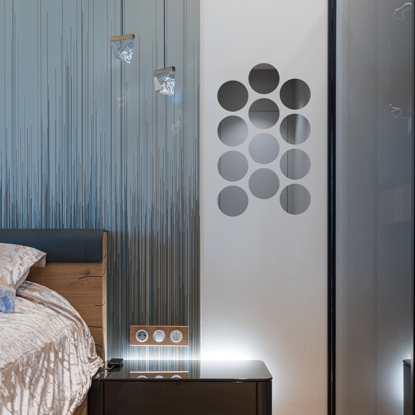 Acrylic round mirror wall stickers on a modern bedroom wall.
