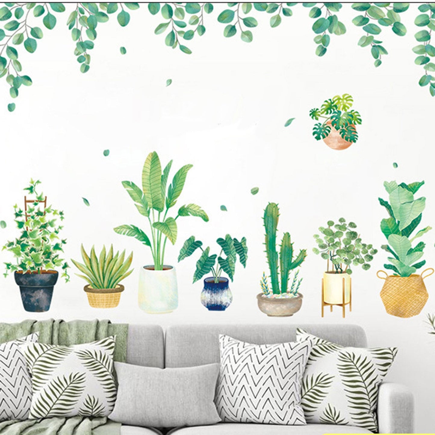 Green tropical wall decals with hanging leaves and potted plants.