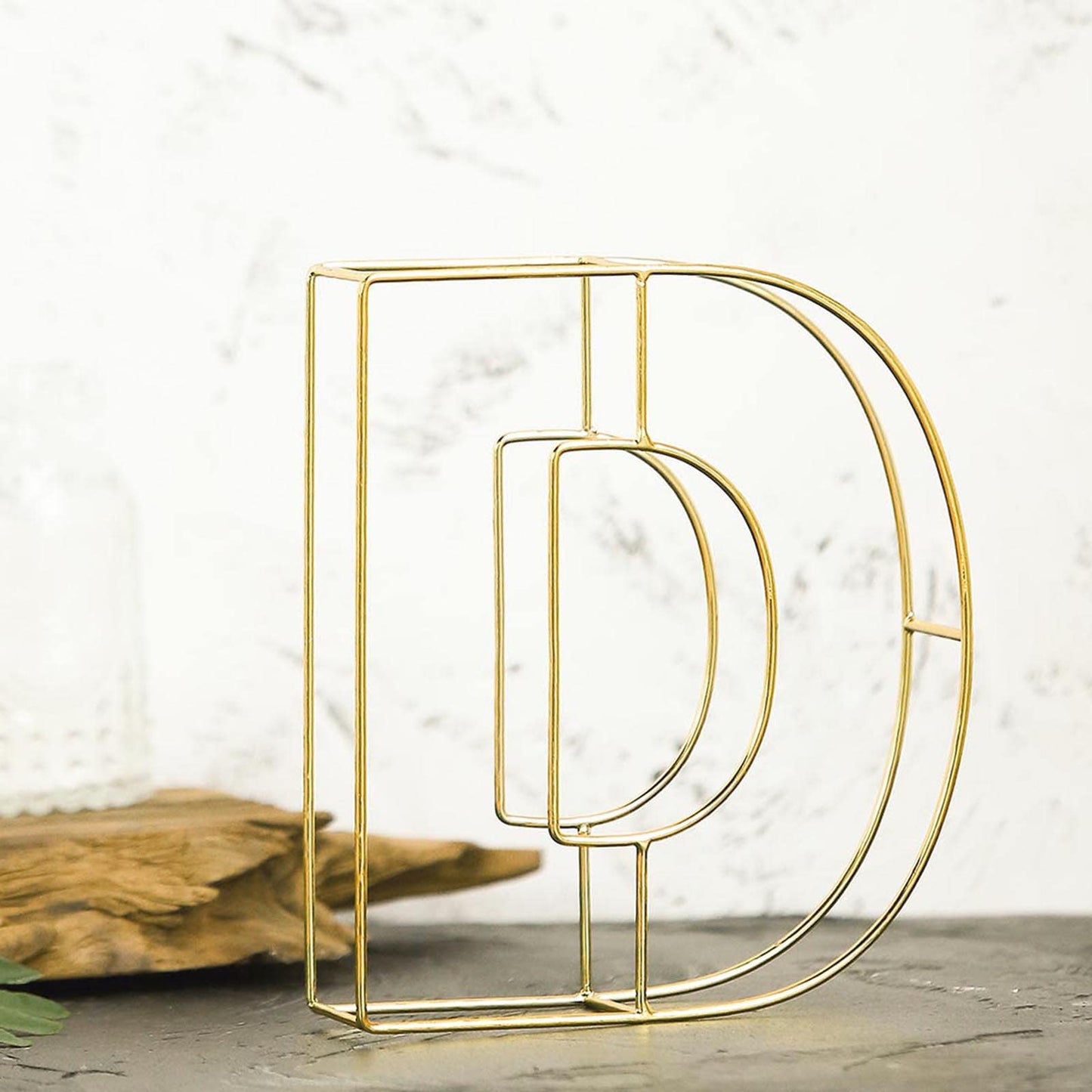 Gold decorative wire letter "D" centerpiece for weddings, 8 inches tall.