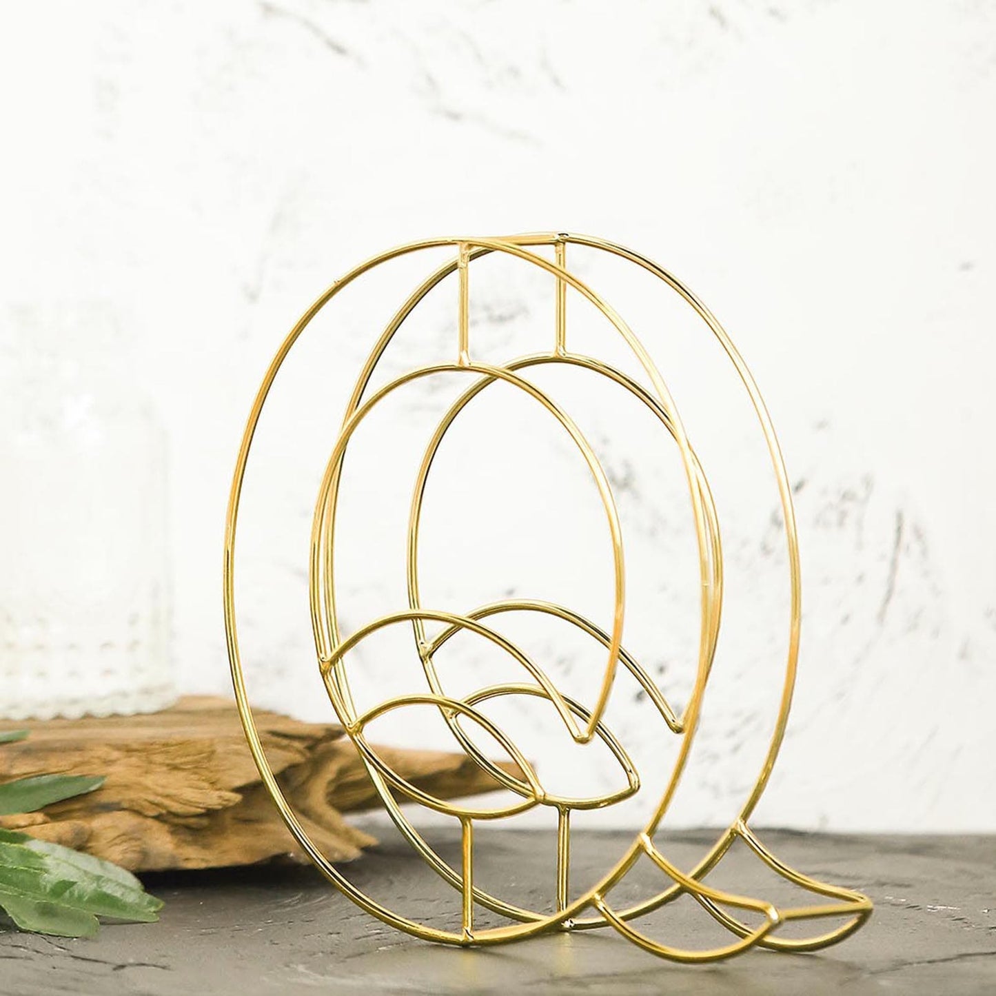 Gold freestanding 3D decorative wire letter "Q" wedding centerpiece.