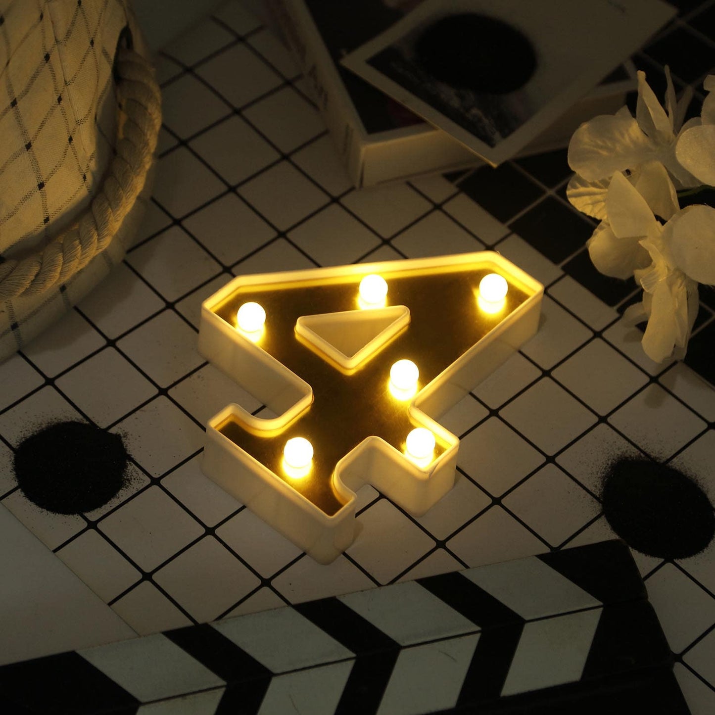 Gold 3D marquee number 4 with warm white LED lights.