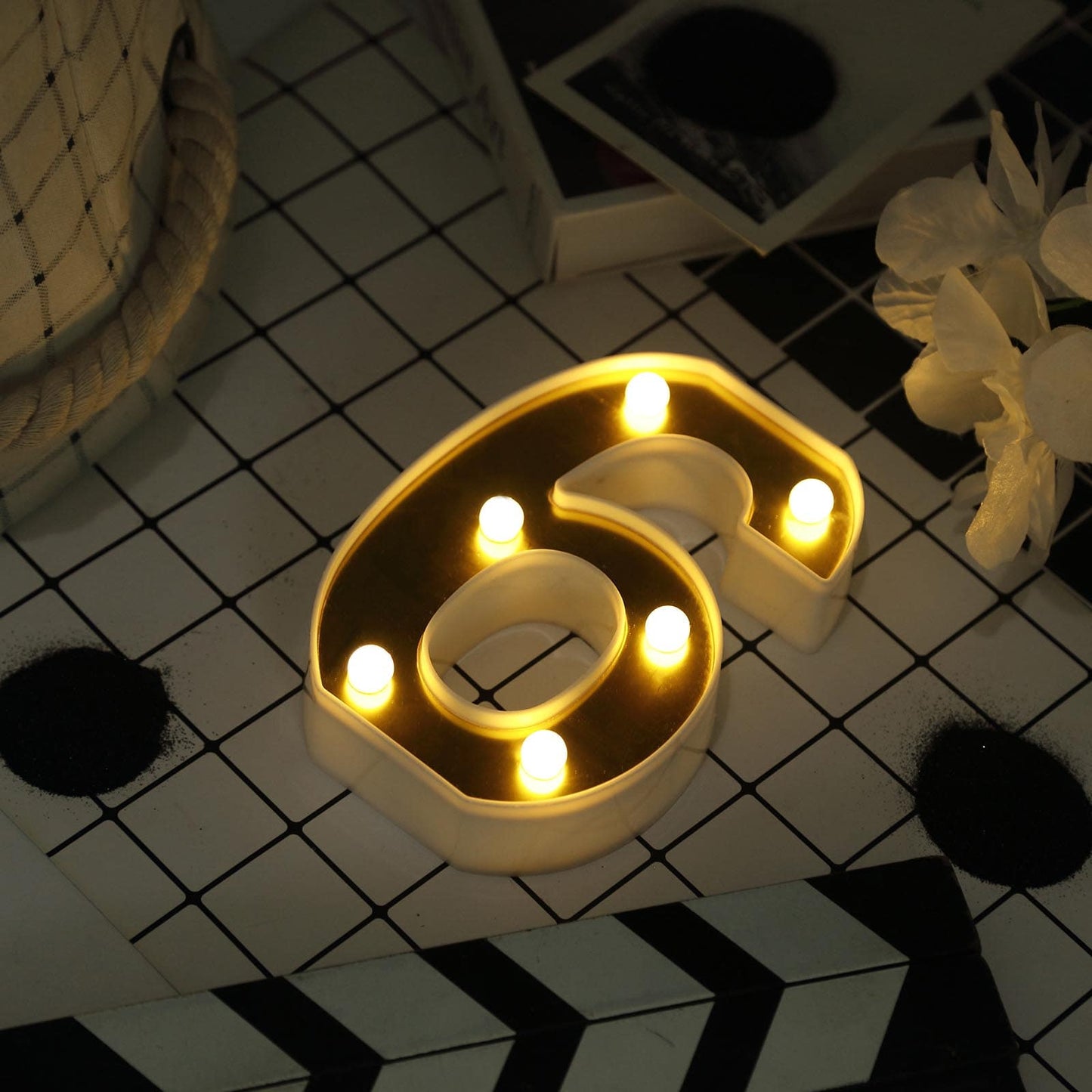 Gold 3D marquee number 6 with warm white LED lights.