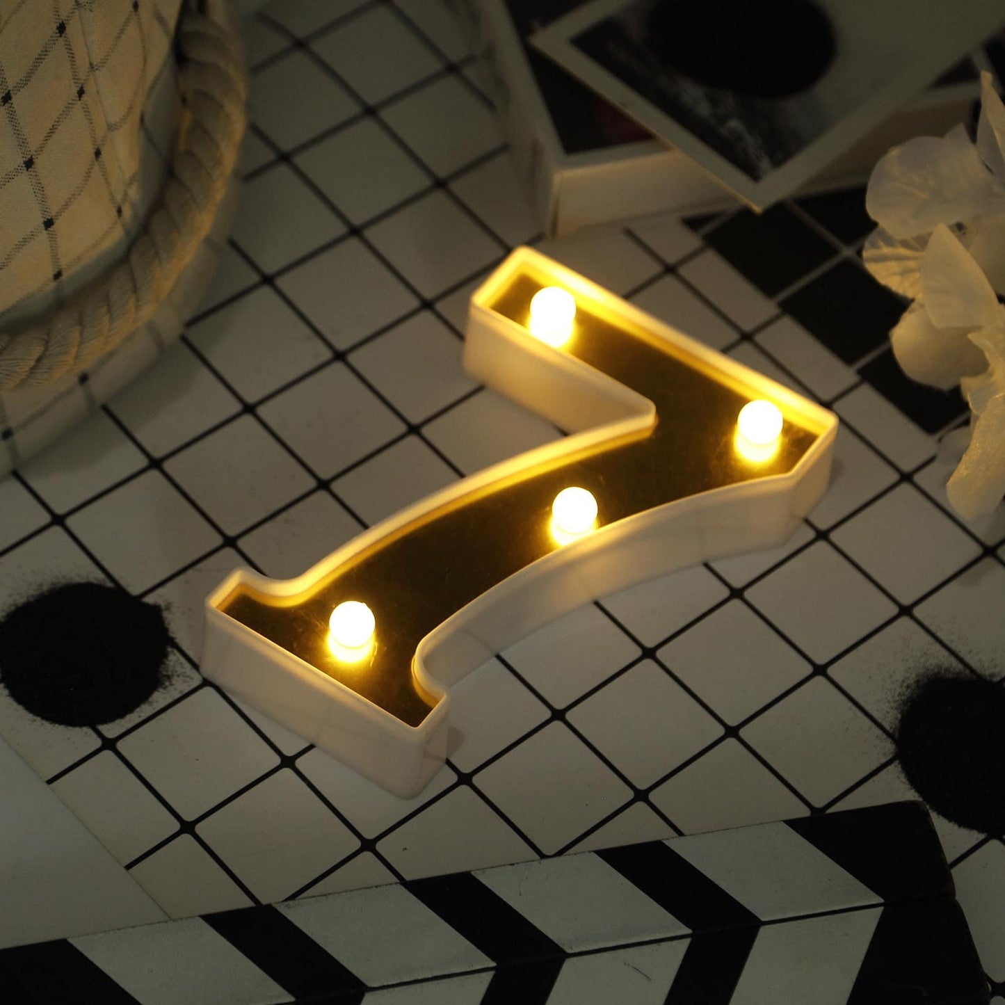 Warm white 3D marquee number 7 with LED lights.