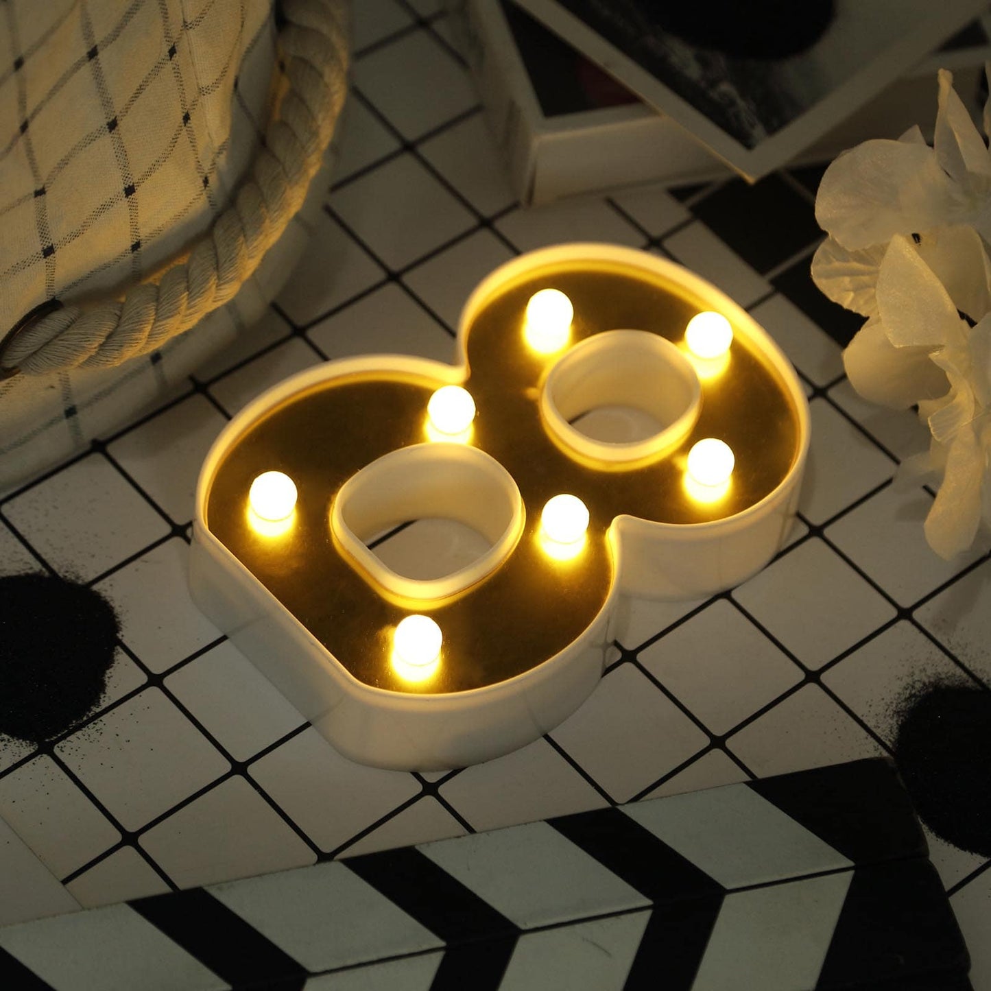 Gold 3D marquee number 8 with warm white LED lights.