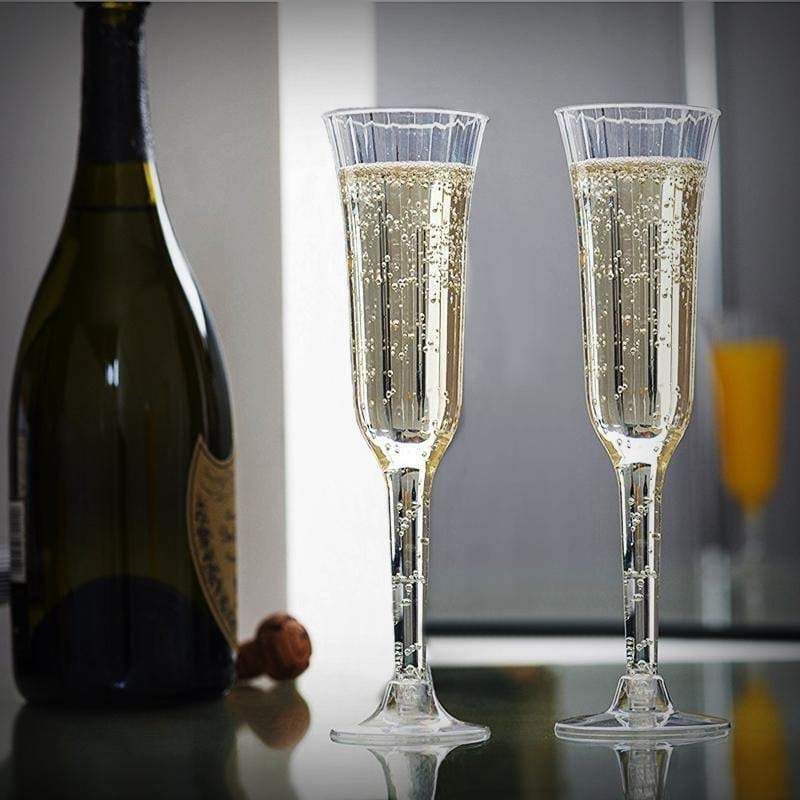 Clear plastic champagne flutes with flared design and detachable base.