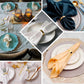Shiny gold semicircle napkin rings for elegant table settings.