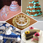 Blush triangular paper cake boxes with scalloped tops for desserts.