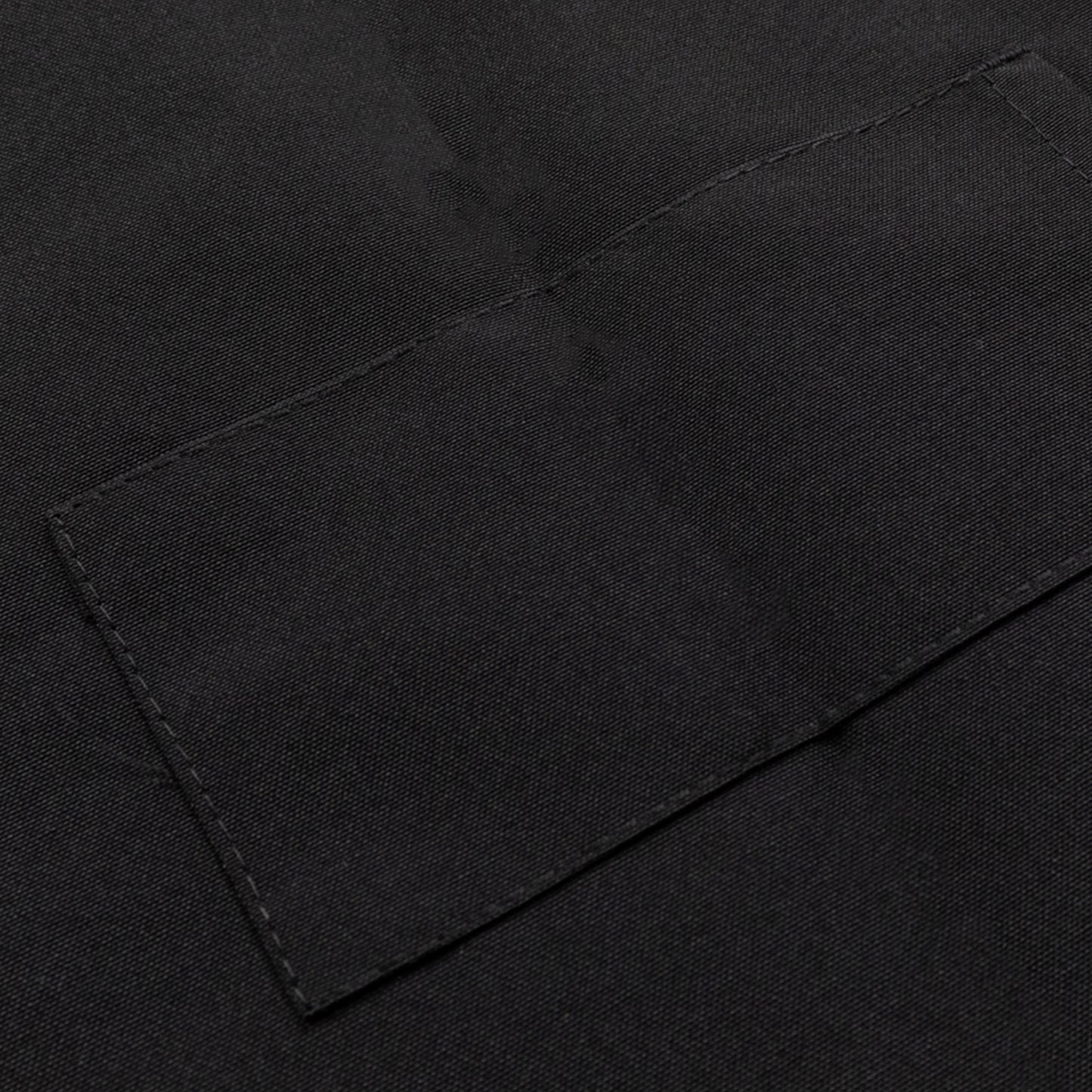 Black premium polyester cooking chef apron with adjustable neck and long ties.