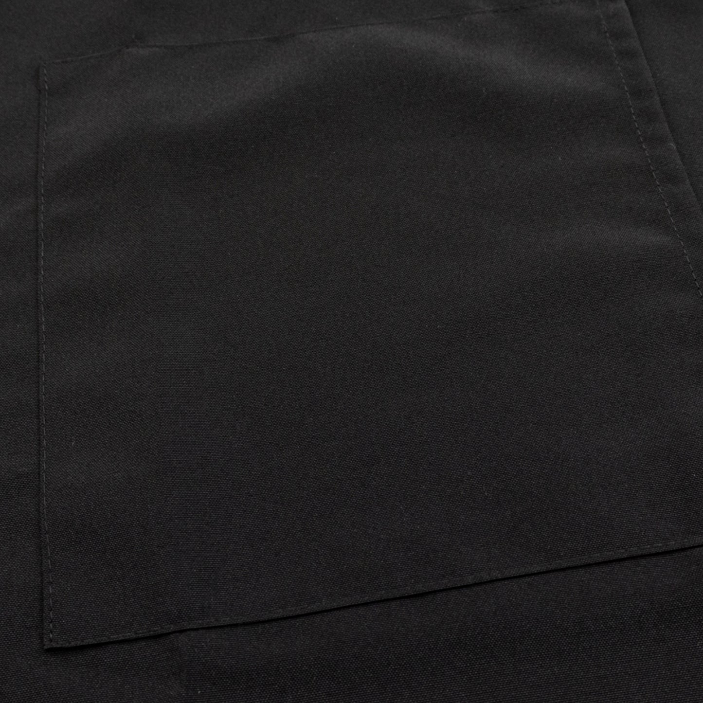 Black premium polyester cooking chef apron with adjustable neck and pockets.