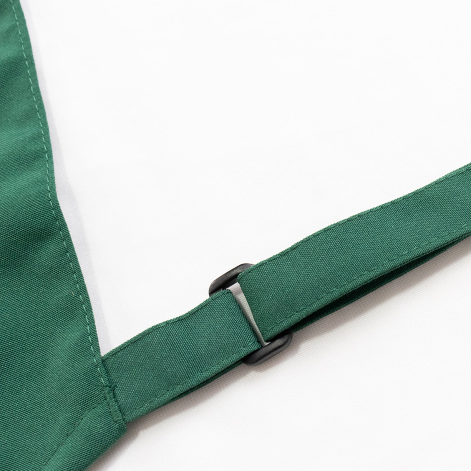 Emerald green cooking chef apron with adjustable neck and long ties.