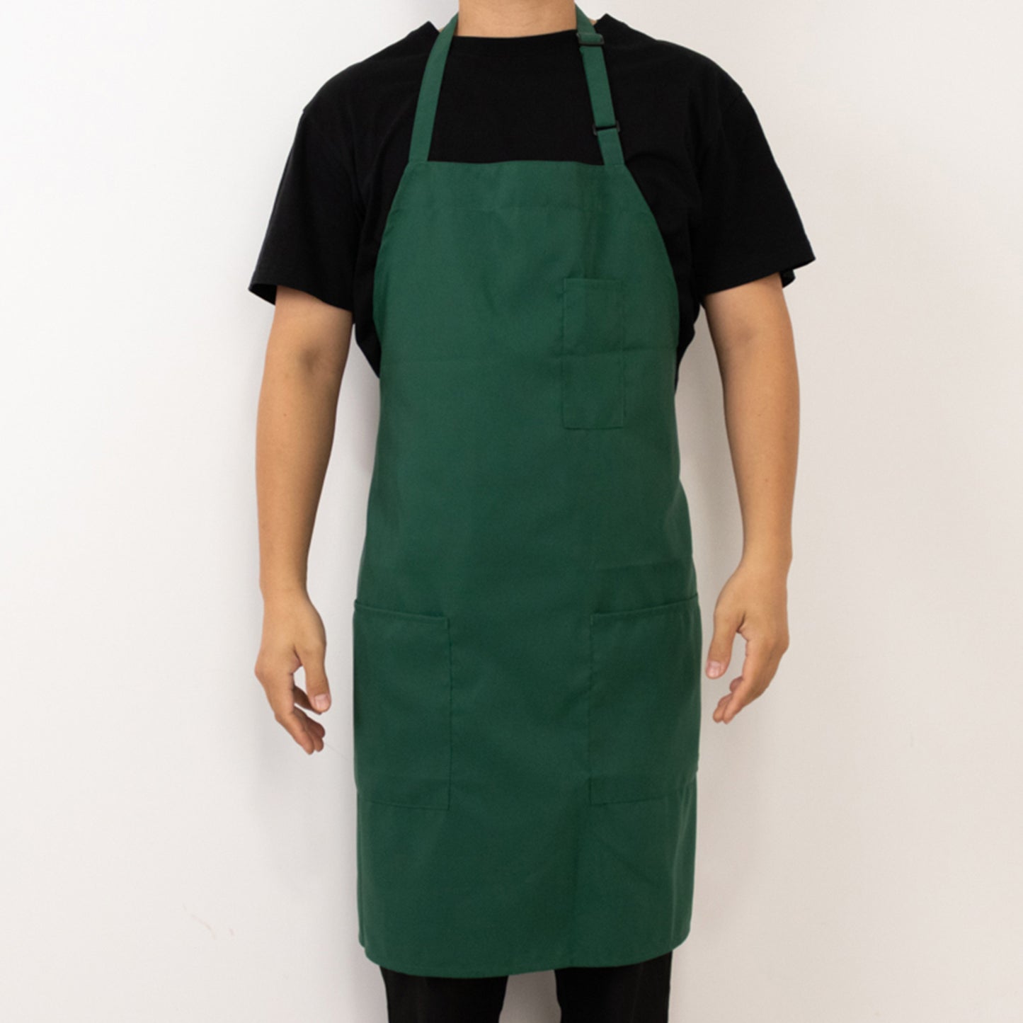 Emerald green premium polyester cooking chef apron with two pockets.