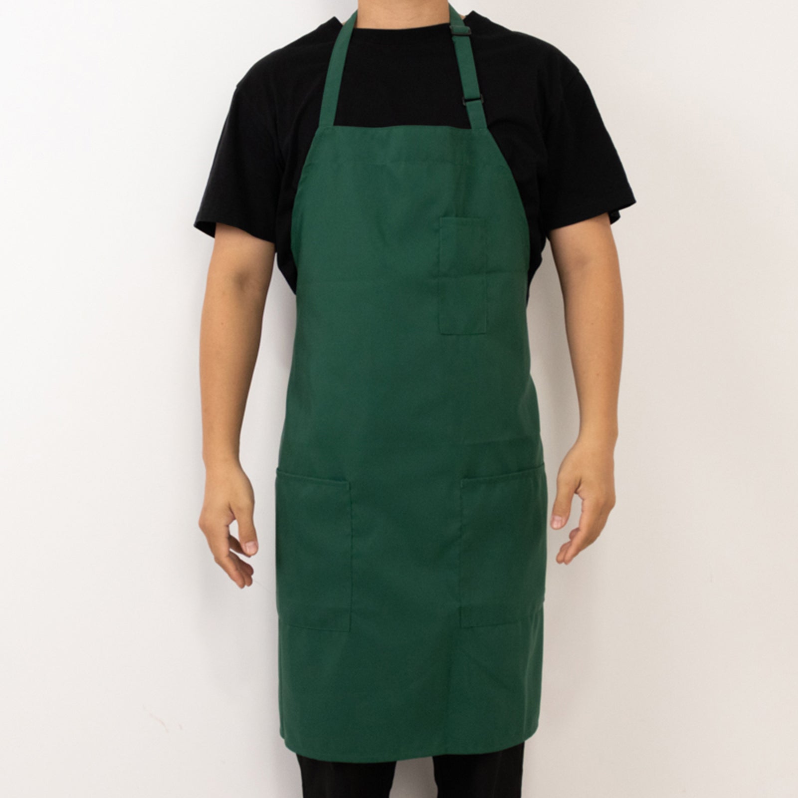 Emerald green premium polyester cooking chef apron with two pockets.