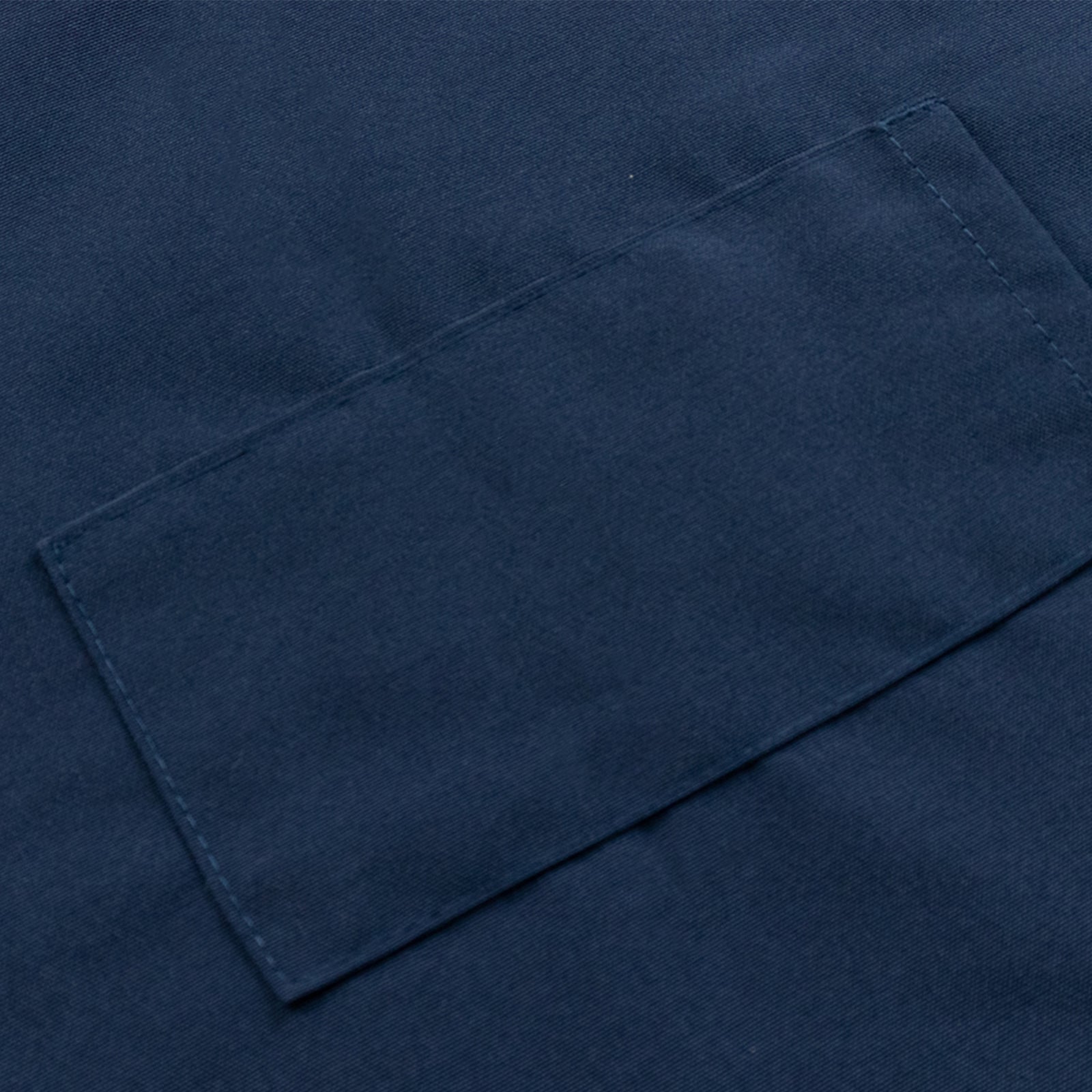 Navy blue cooking chef apron with adjustable neck and two pockets.