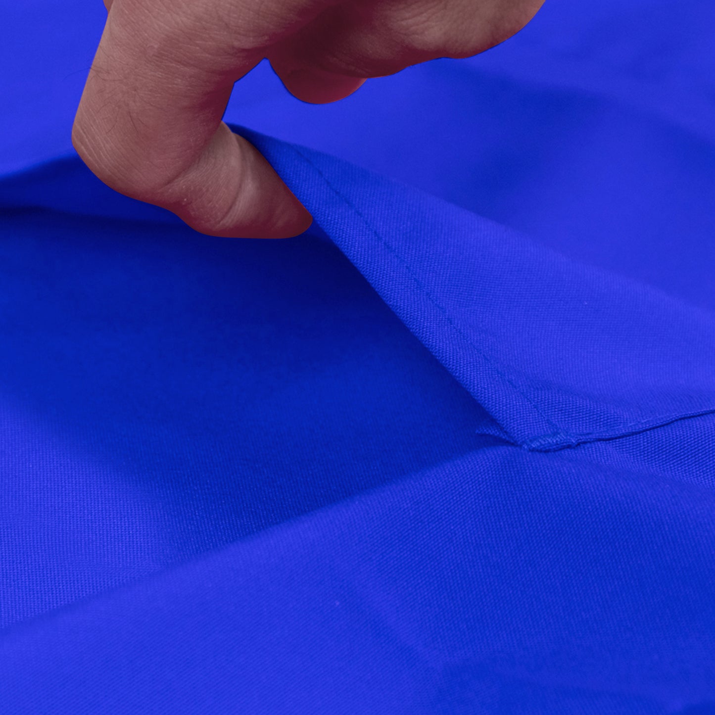 Royal blue premium polyester cooking chef apron fabric close-up.