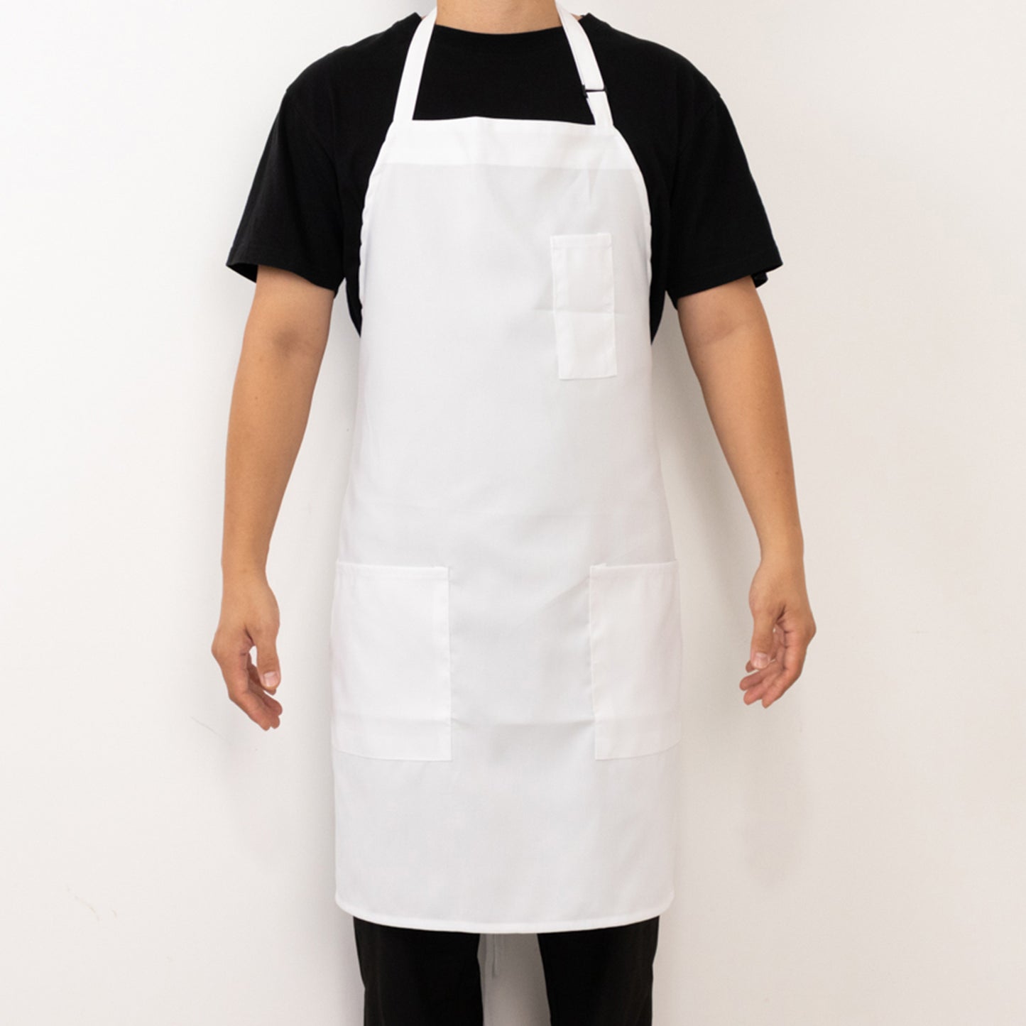 White unisex cooking apron with adjustable neck and two pockets.
