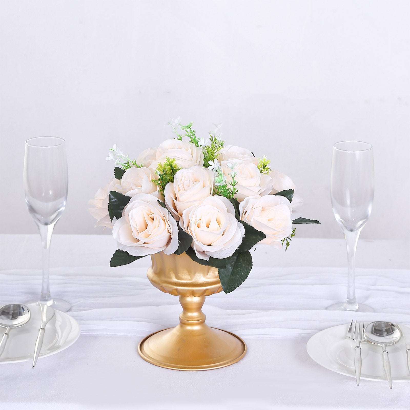 Cream silk rose flower ball centerpiece arrangement in a gold vase.