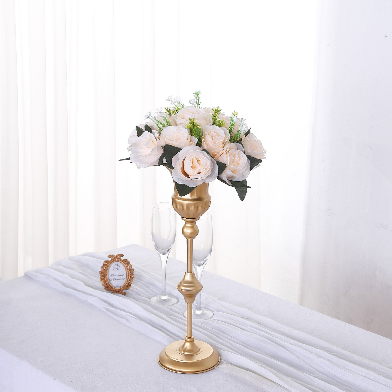 Cream silk rose flower ball centerpiece arrangement in a gold holder.