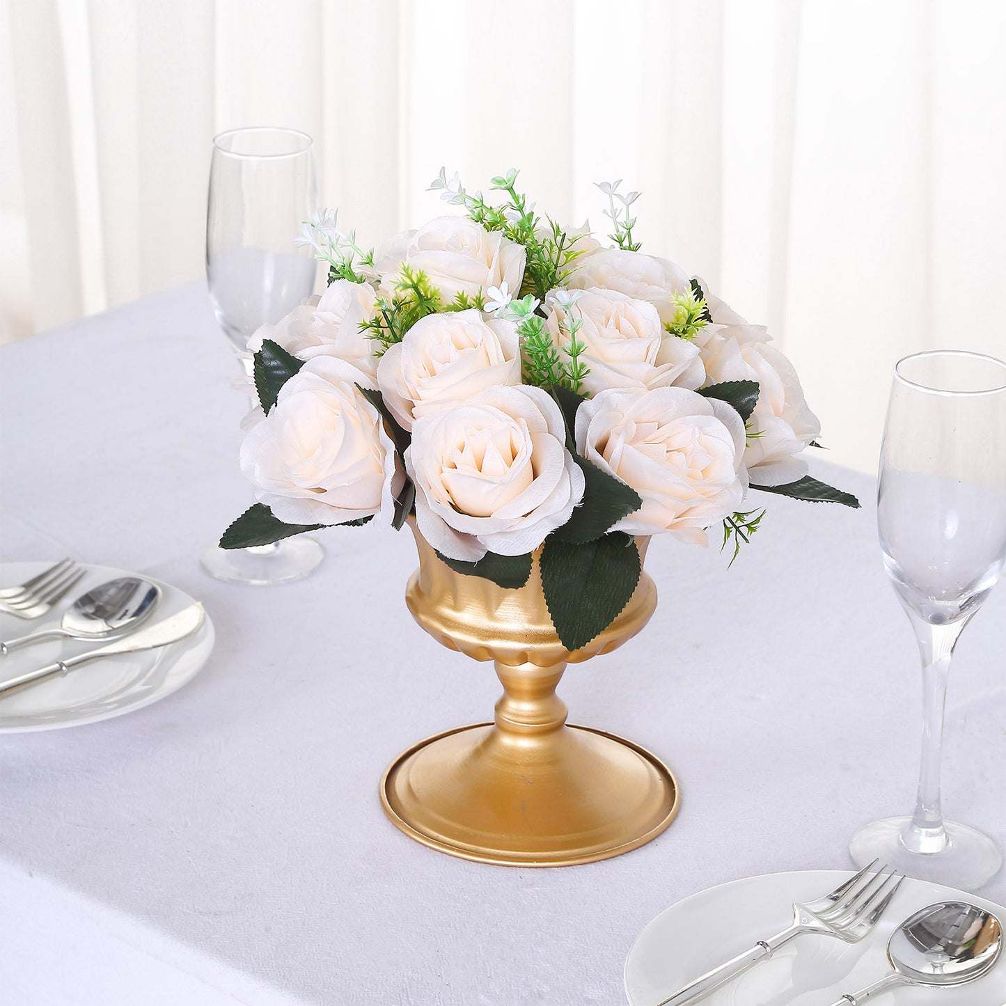Cream silk rose flower ball centerpiece arrangement in a gold vase.