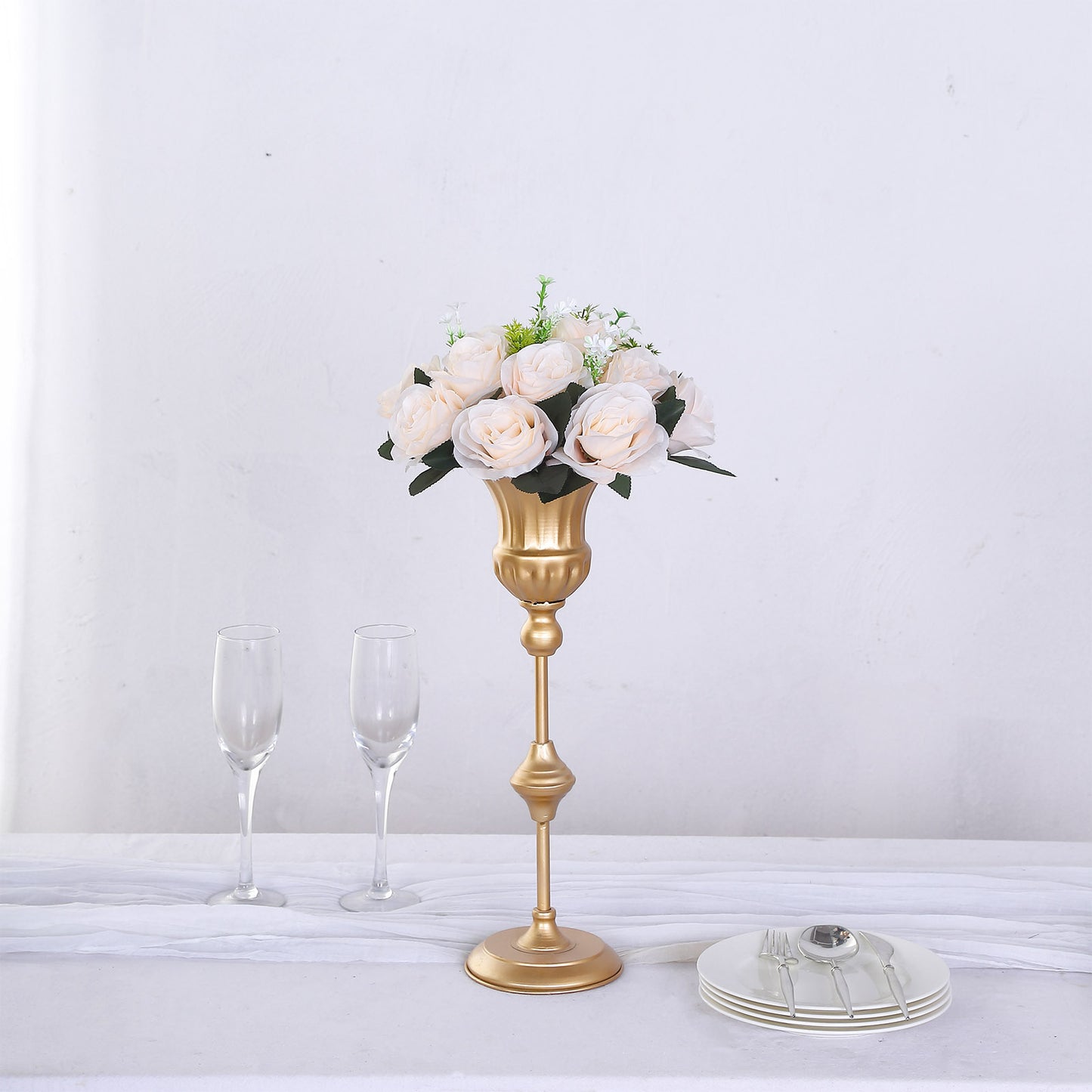 Cream silk rose flower ball centerpiece arrangement in a gold holder.