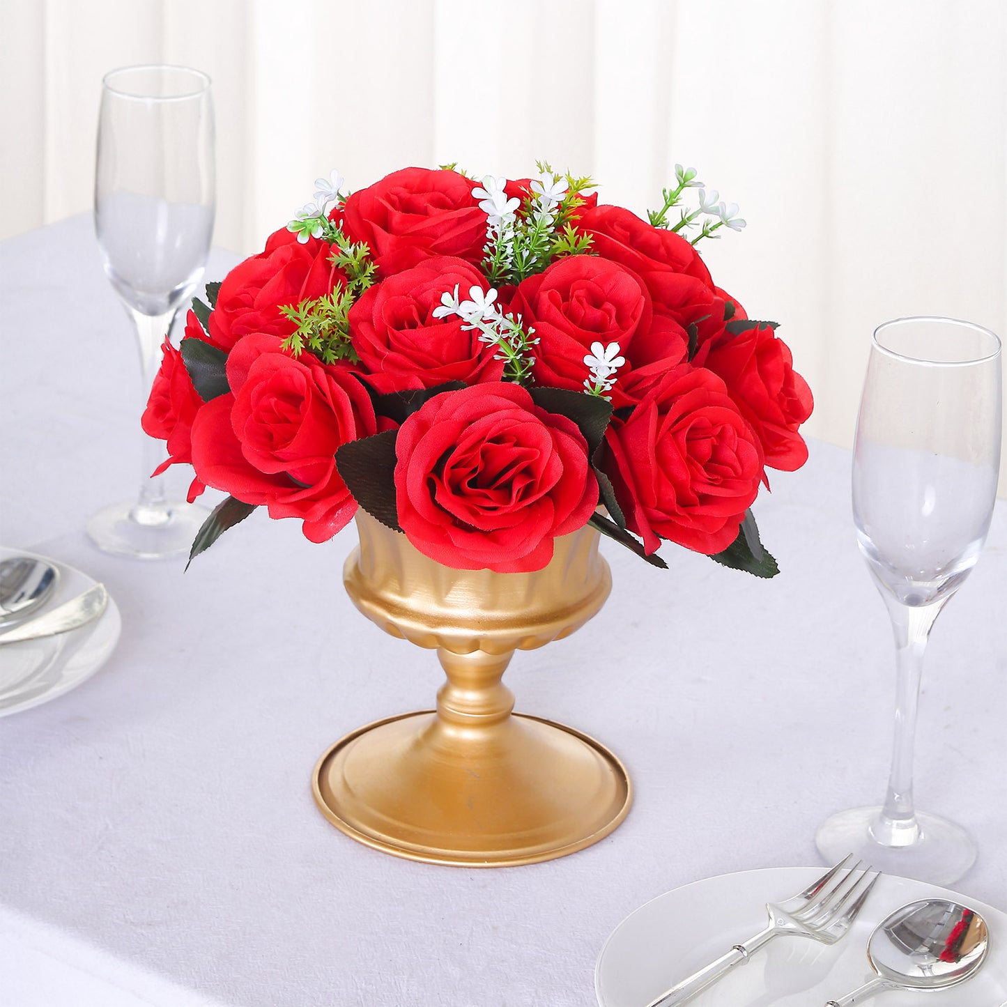 Red silk rose flower ball centerpiece arrangement in a gold vase.