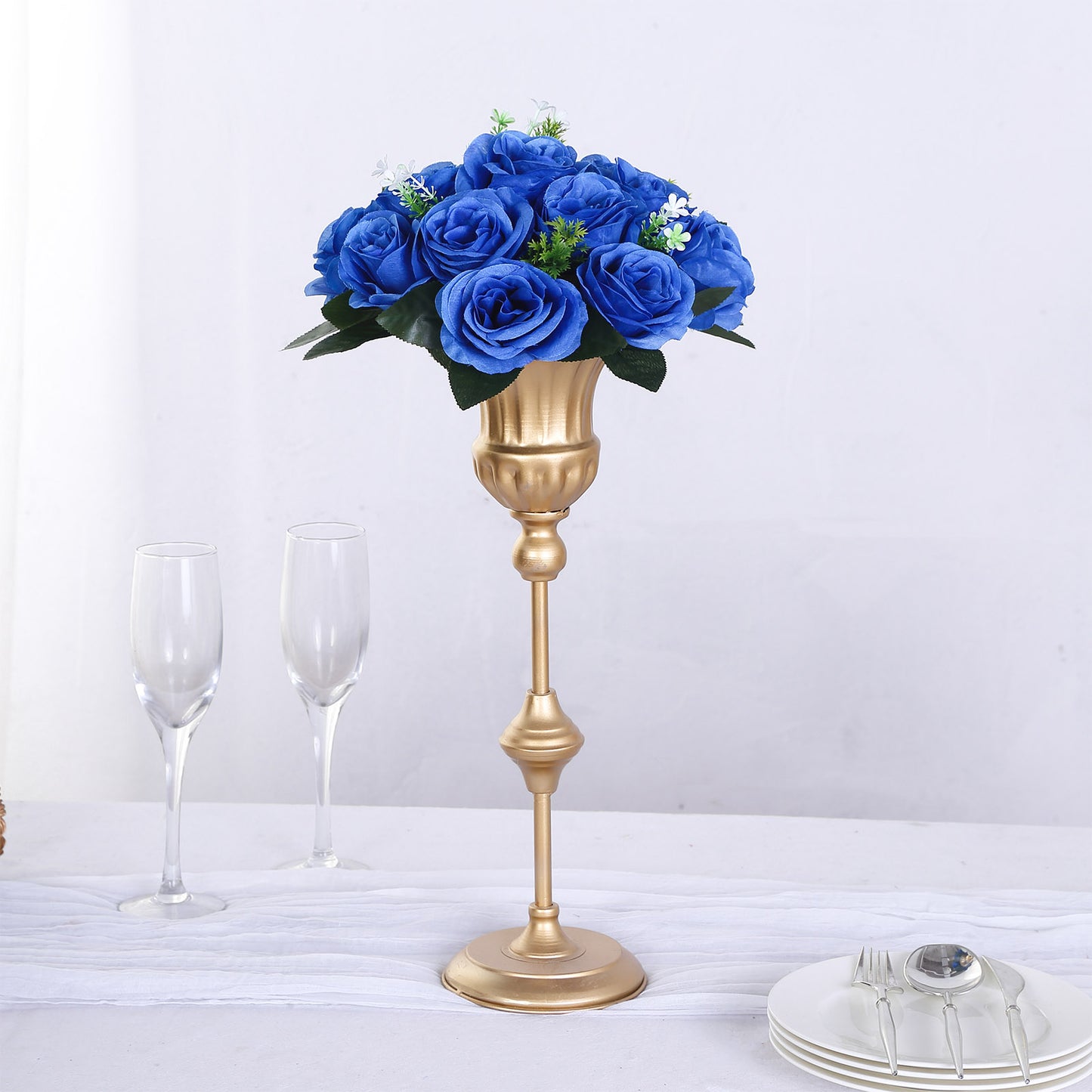 Royal blue silk rose flower ball centerpiece arrangement in a gold vase.