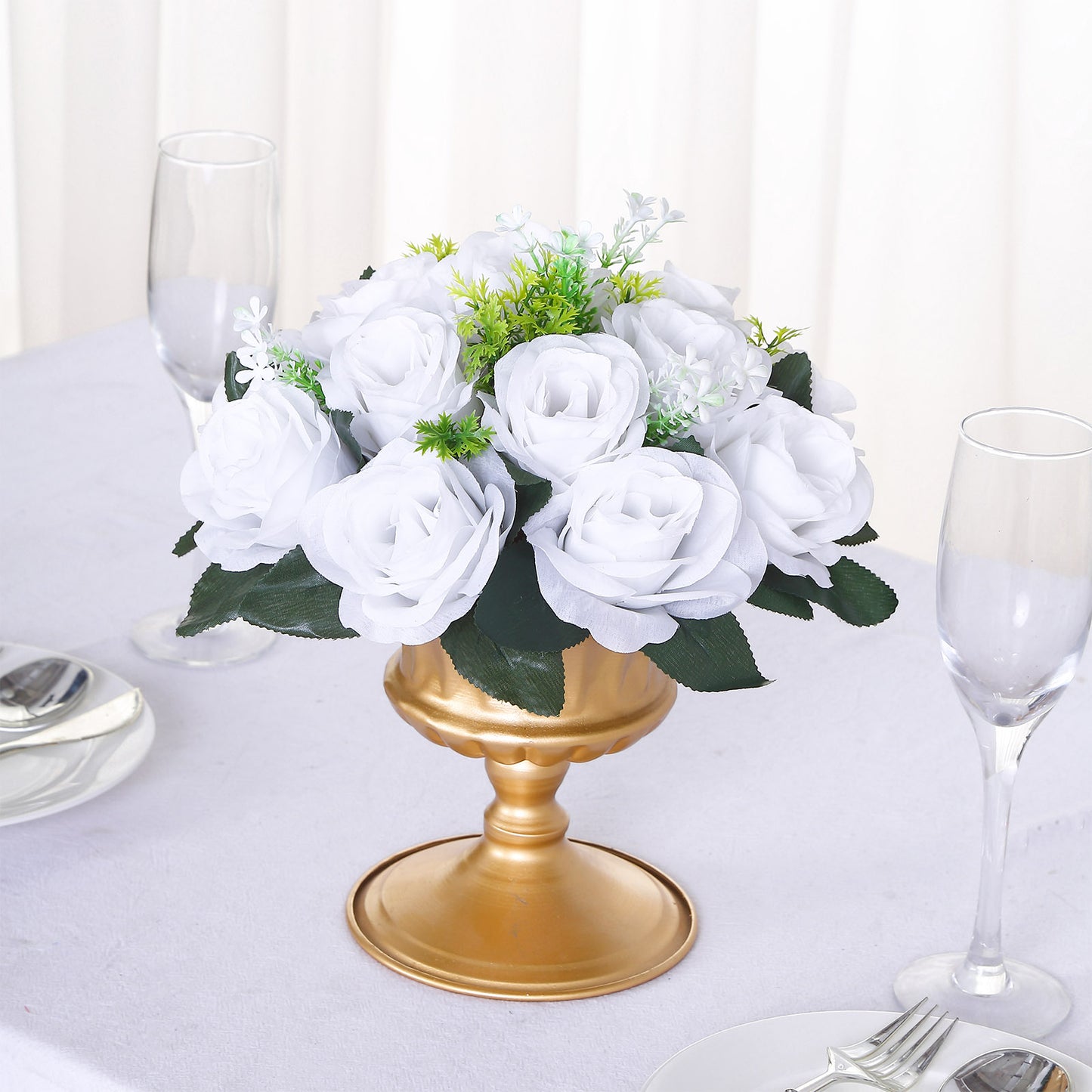 White silk rose flower ball centerpiece arrangement in a gold vase.